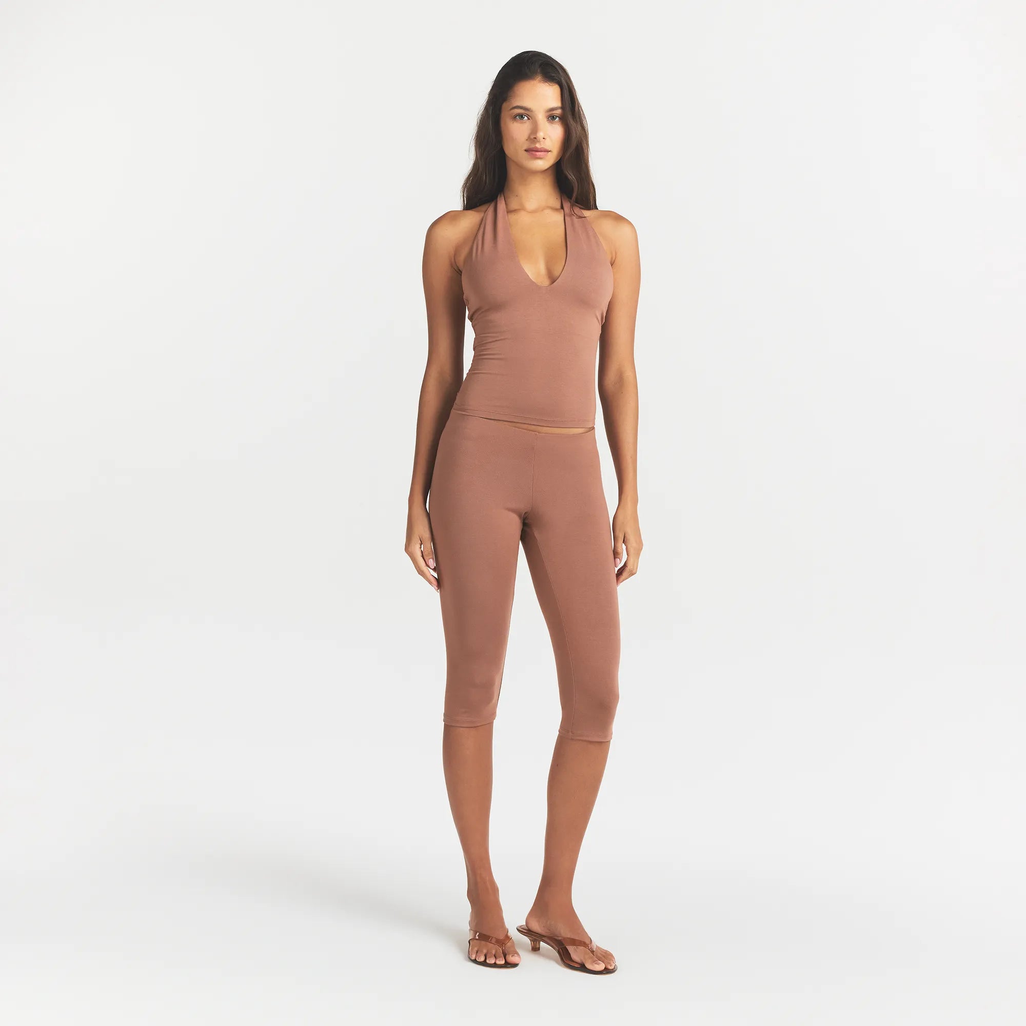 SMOOTH LAYERS HIGH-WAISTED CAPRI | NUTMEG ON A MODEL FRONT VIEW @ | FOCUS: 0.0, 1.0, 0.9