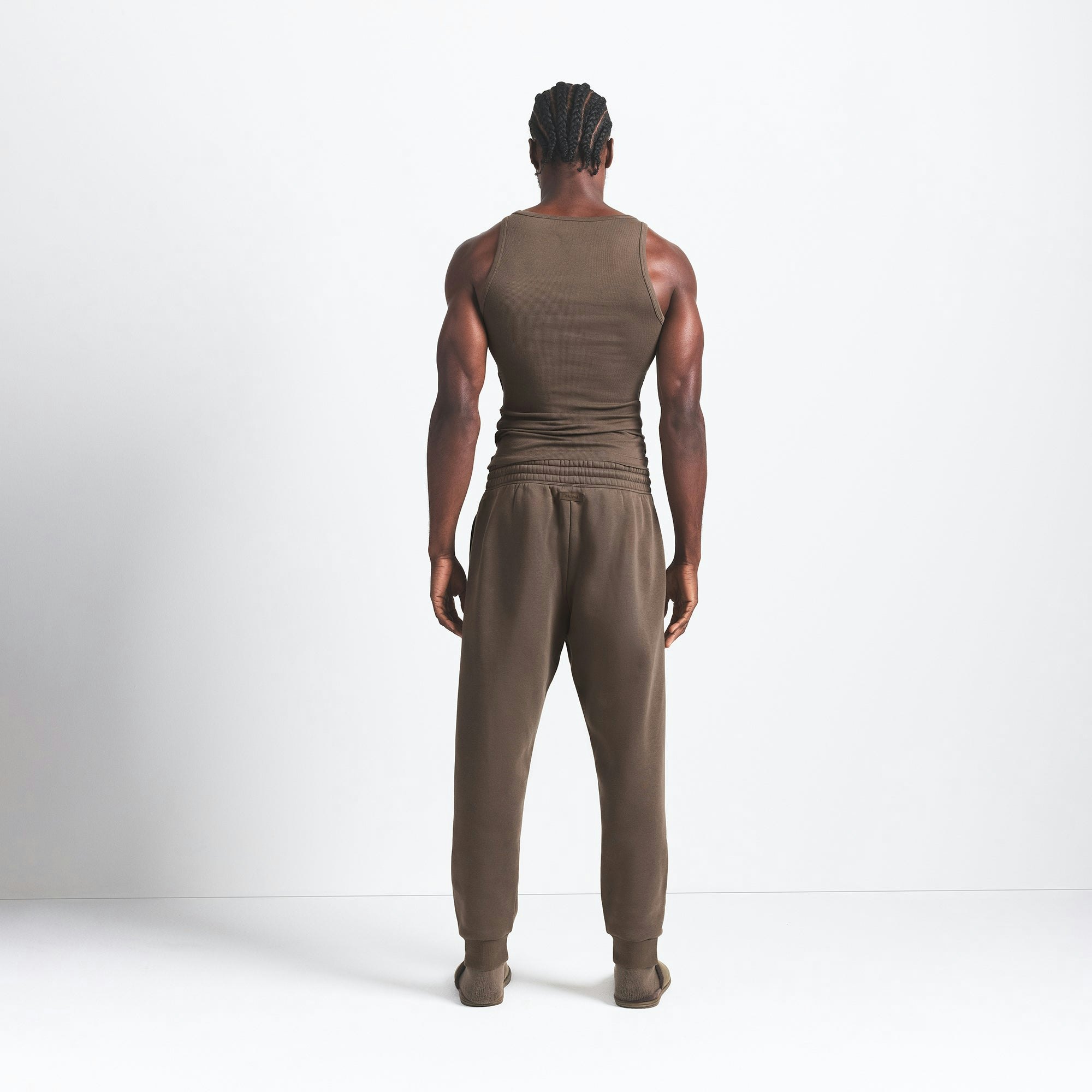 FLEECE LOUNGE MENS TAPERED JOGGER | DRIFTWOOD ON A MODEL BACK VIEW @ | FOCUS: 0.9, 0.1, 0.7