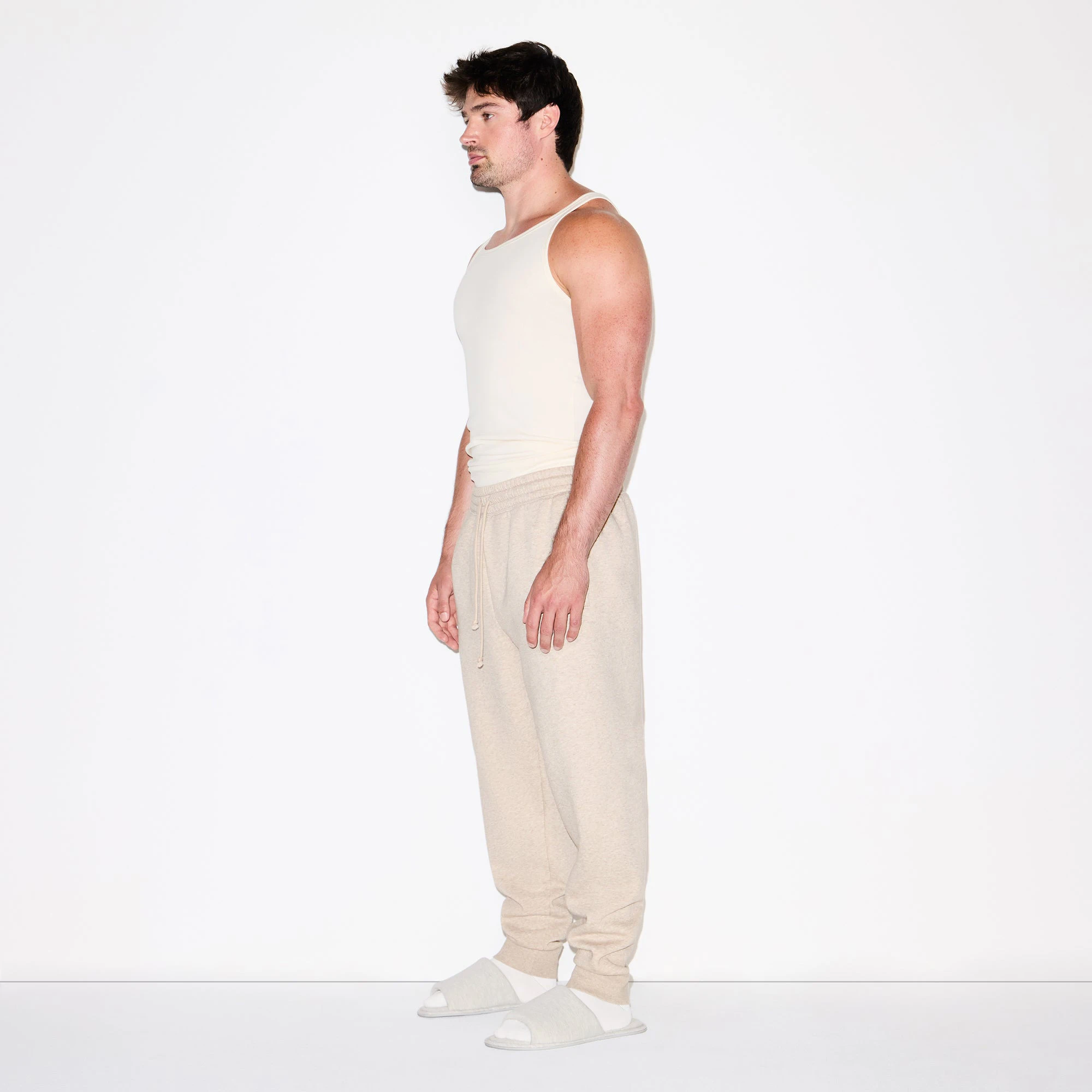FLEECE LOUNGE MENS TAPERED JOGGER | DESERT HEATHER ON A MODEL FRONT VIEW @ | FOCUS: 0.0, 1.0, 0.9