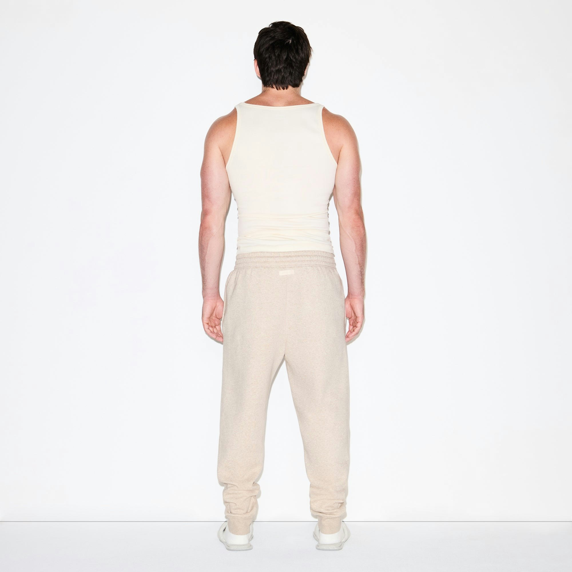 FLEECE LOUNGE MENS TAPERED JOGGER | DESERT HEATHER ON A MODEL FRONT VIEW @ | FOCUS: 0.0, 1.0, 0.9