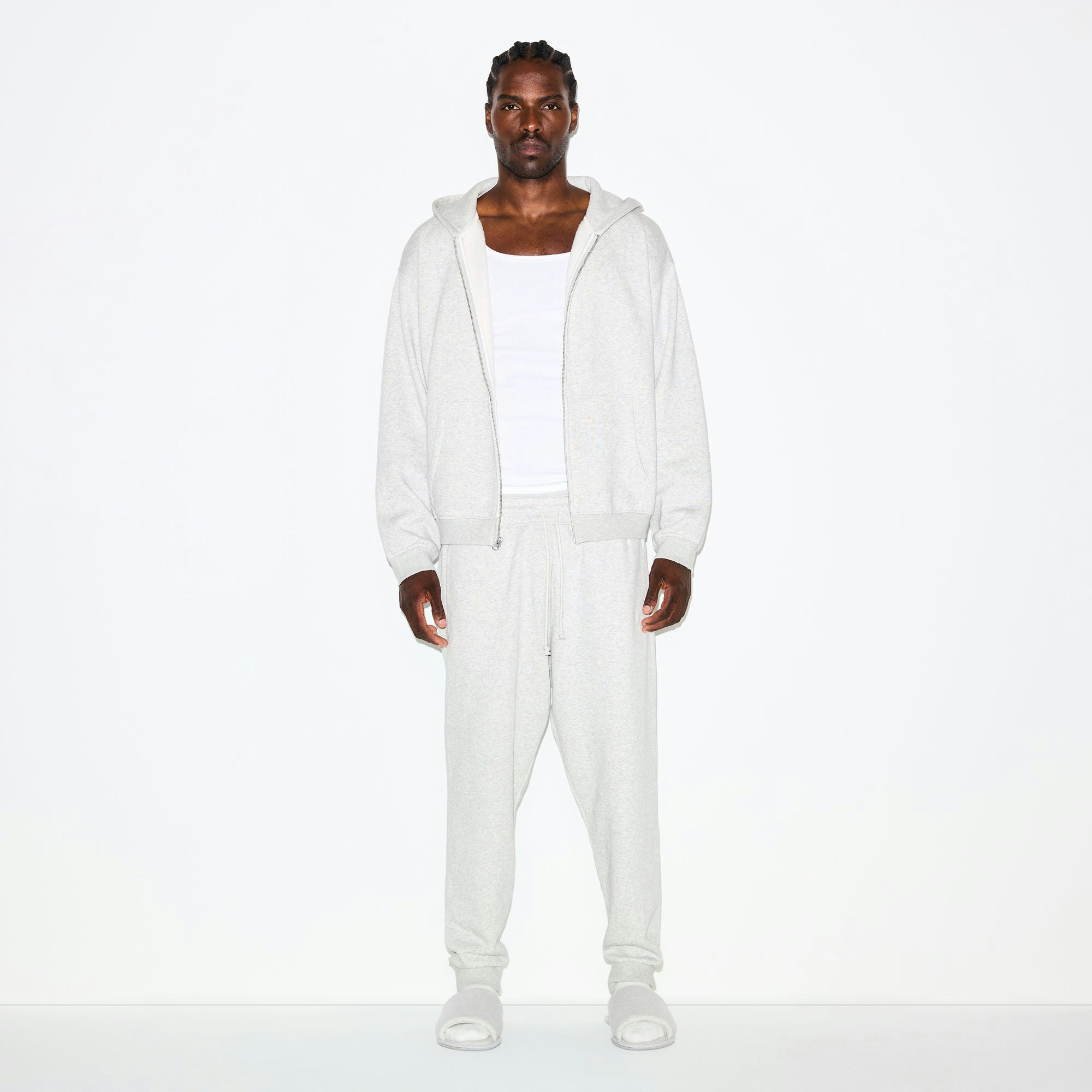FLEECE LOUNGE MENS TAPERED JOGGER | LIGHT HEATHER GREY ON A MODEL FRONT VIEW @ | FOCUS: 0.0, 1.0, 0.9