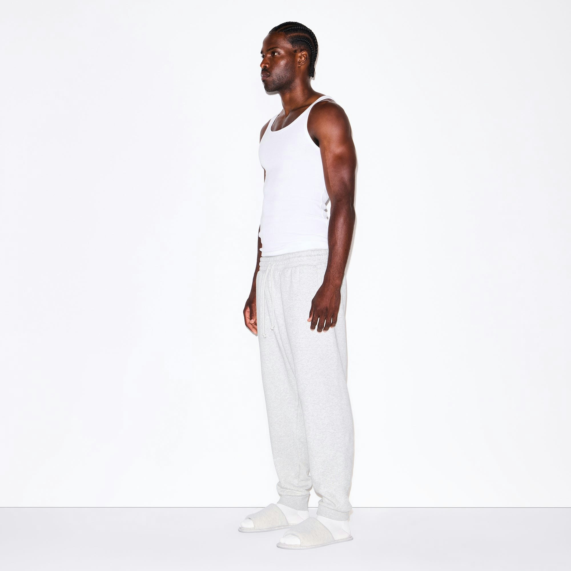 FLEECE LOUNGE MENS TAPERED JOGGER | LIGHT HEATHER GREY ON A MODEL FRONT VIEW @ | FOCUS: 0.0, 1.0, 0.9
