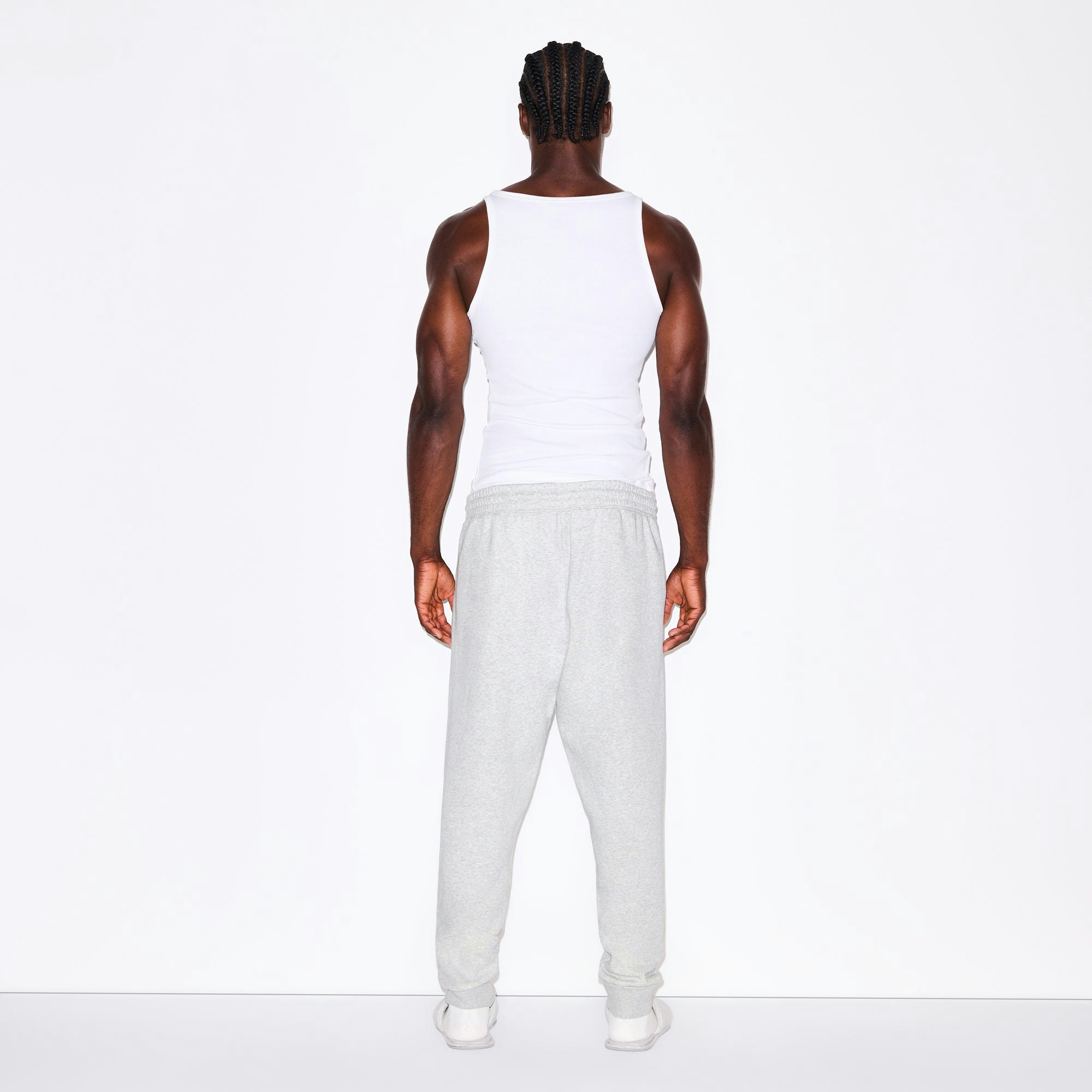 FLEECE LOUNGE MENS TAPERED JOGGER | LIGHT HEATHER GREY ON A MODEL FRONT VIEW @ | FOCUS: 0.0, 1.0, 0.9