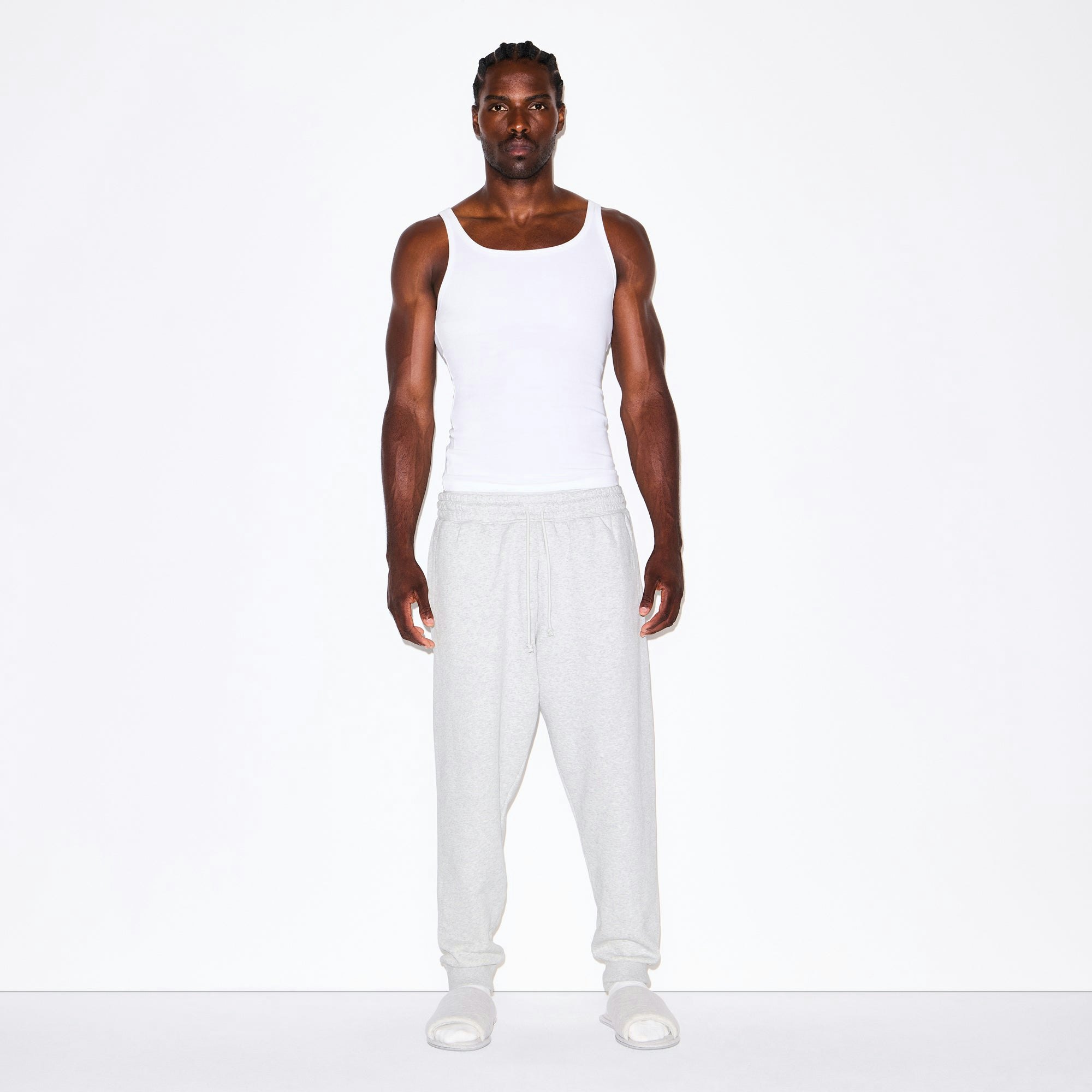 FLEECE LOUNGE MENS TAPERED JOGGER | LIGHT HEATHER GREY ON A MODEL FRONT VIEW @ | FOCUS: 0.0, 1.0, 0.9