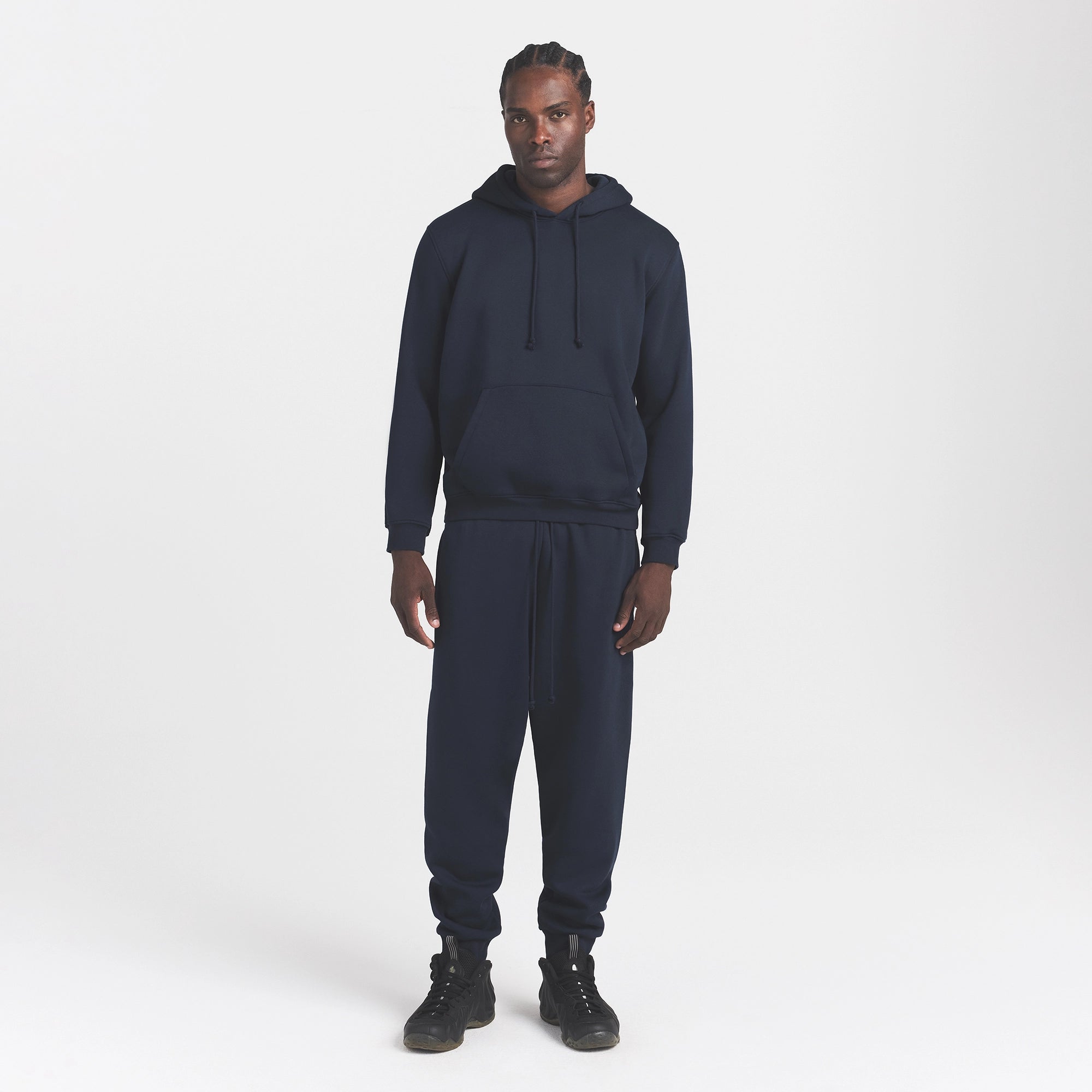 FLEECE LOUNGE MENS TAPERED JOGGER | NAVY ON A MODEL FRONT VIEW @ | FOCUS: 0.0, 1.0, 0.9