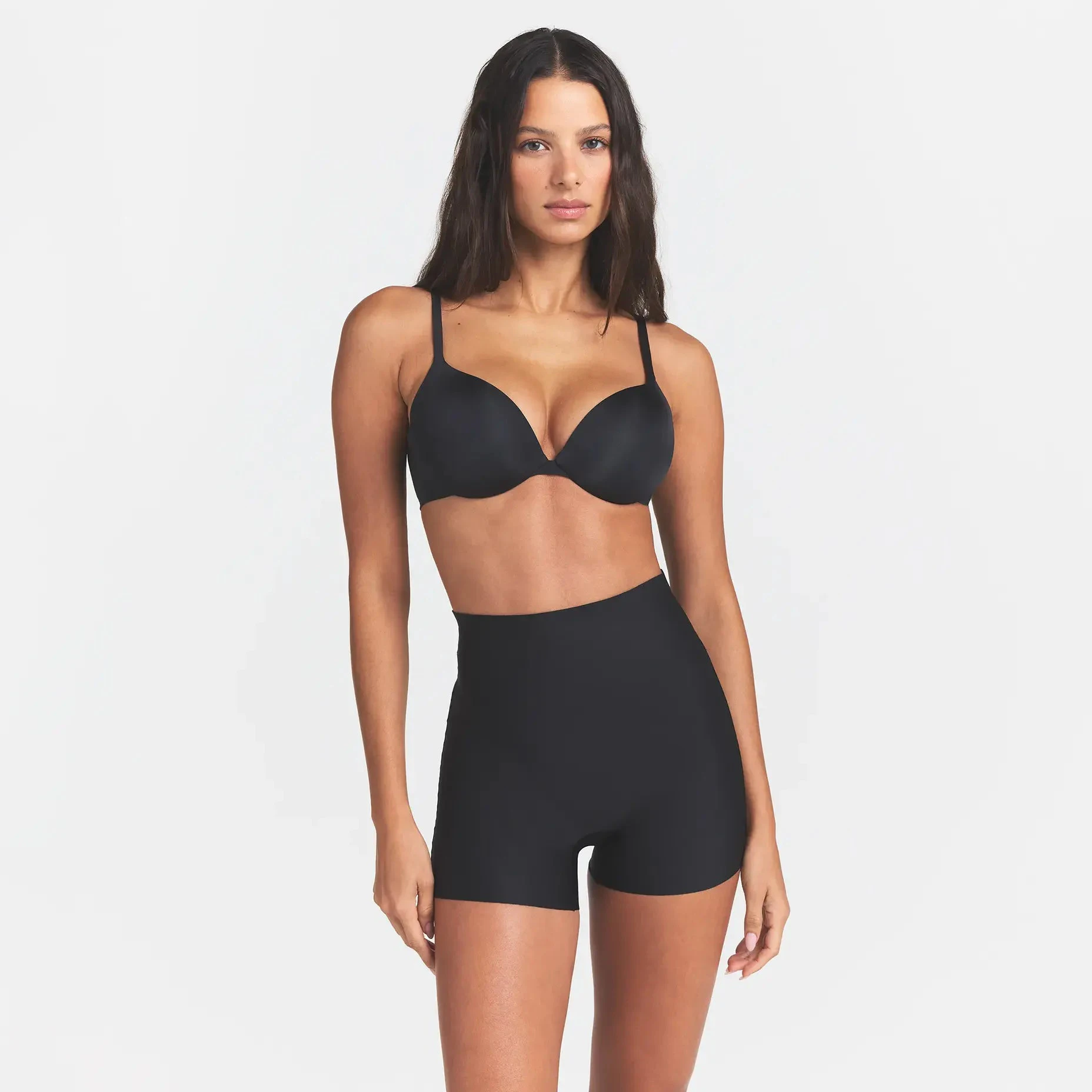 SKIMS BODY CORE SCULPT SHORTIE | ONYX ON A MODEL FRONT VIEW @ | FOCUS: 0.0, 1.0, 0.9