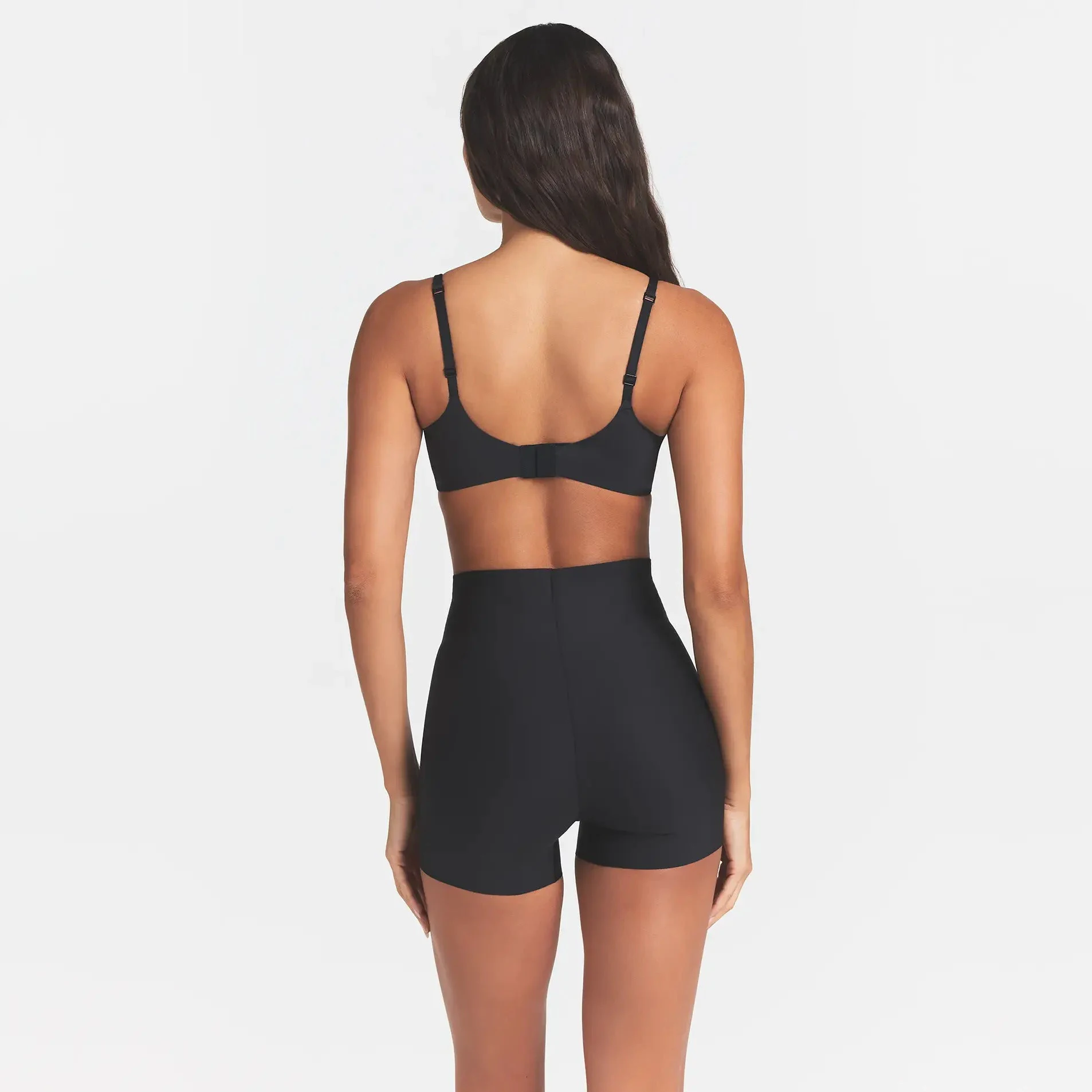 SKIMS BODY CORE SCULPT SHORTIE | ONYX ON A MODEL BACK VIEW @ | FOCUS: 0.0, 1.0, 0.9