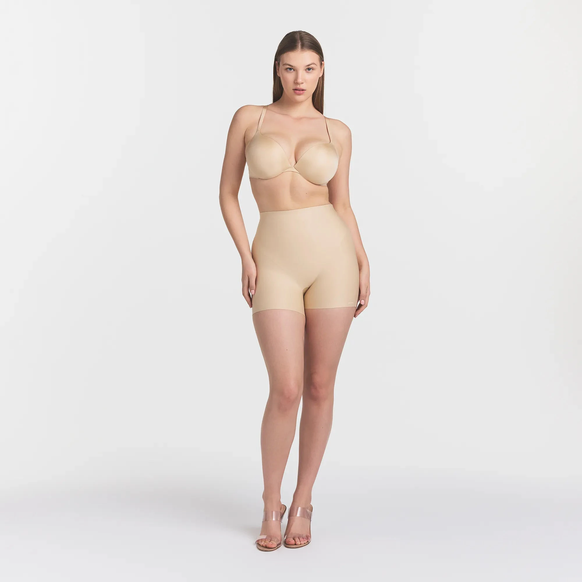 SKIMS BODY CORE SCULPT SHORTIE | SAND ON A MODEL FRONT VIEW @ | FOCUS: 0.0, 1.0, 0.9