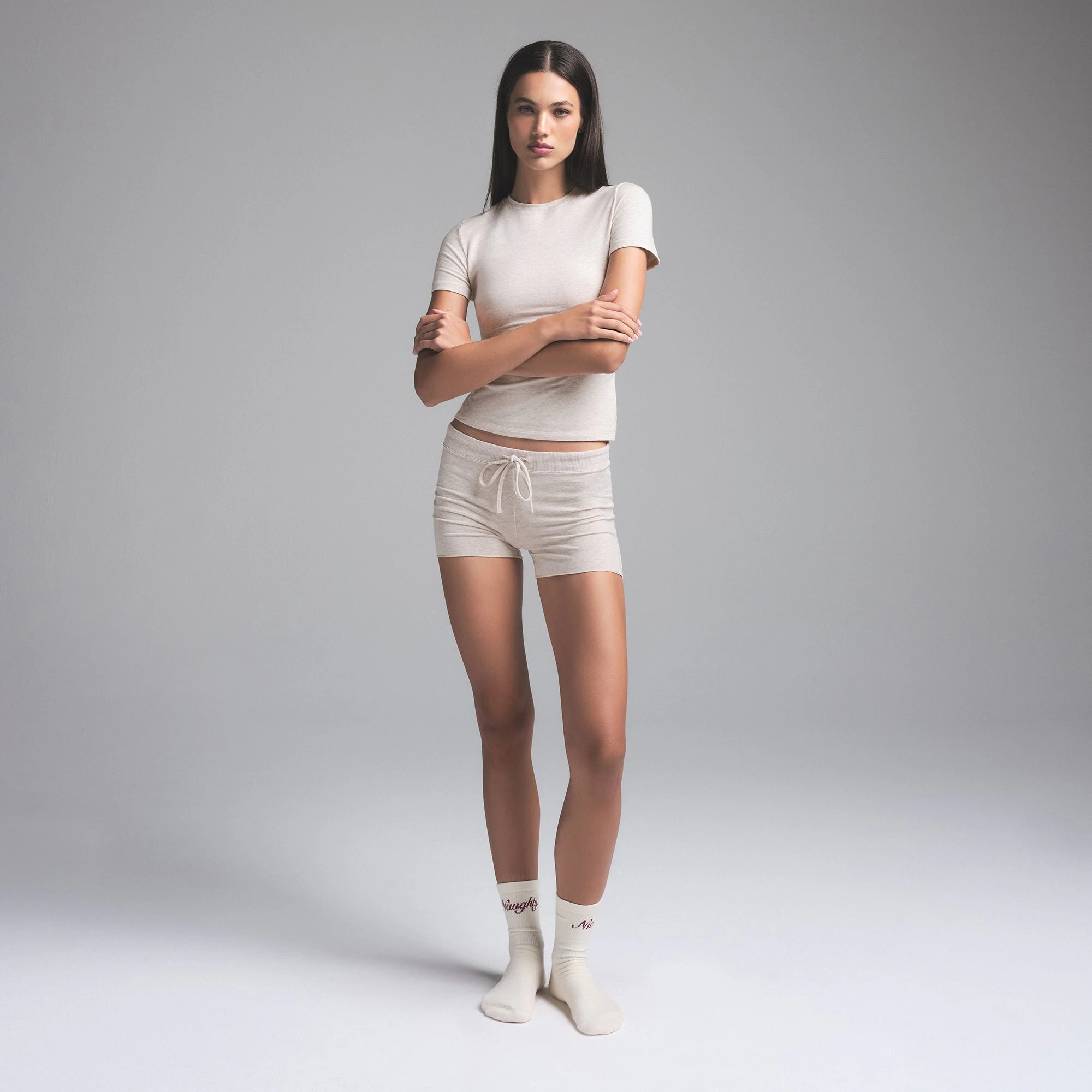 COTTON JERSEY SHORT | HEATHER OATMEAL (SHORTS) ON A MODEL FRONT VIEW