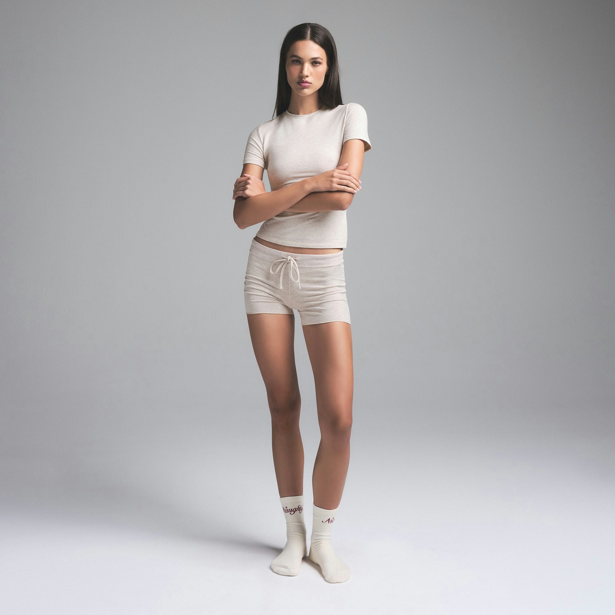 COTTON JERSEY SHORT | HEATHER OATMEAL (SHORTS) ON A MODEL FRONT VIEW