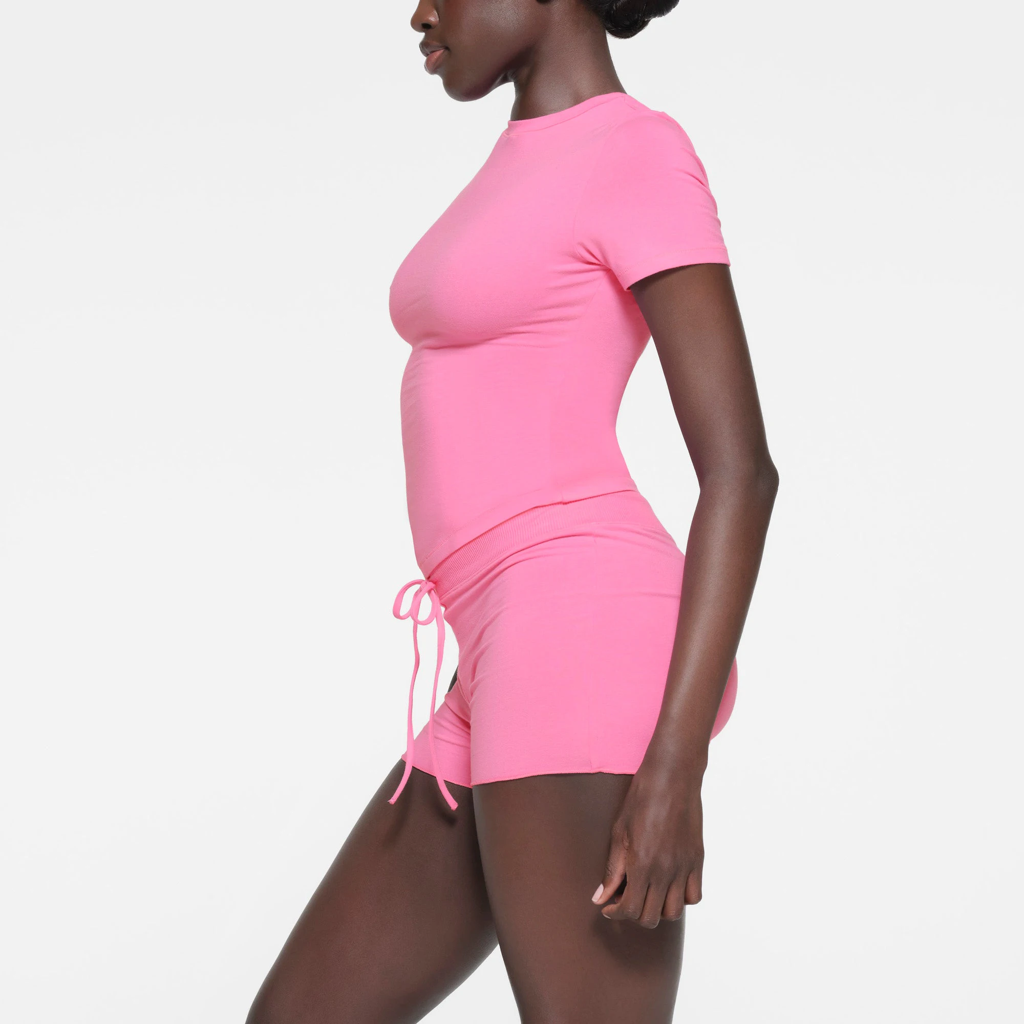 COTTON JERSEY SHORT | SUGAR PINK ON A MODEL SIDE VIEW