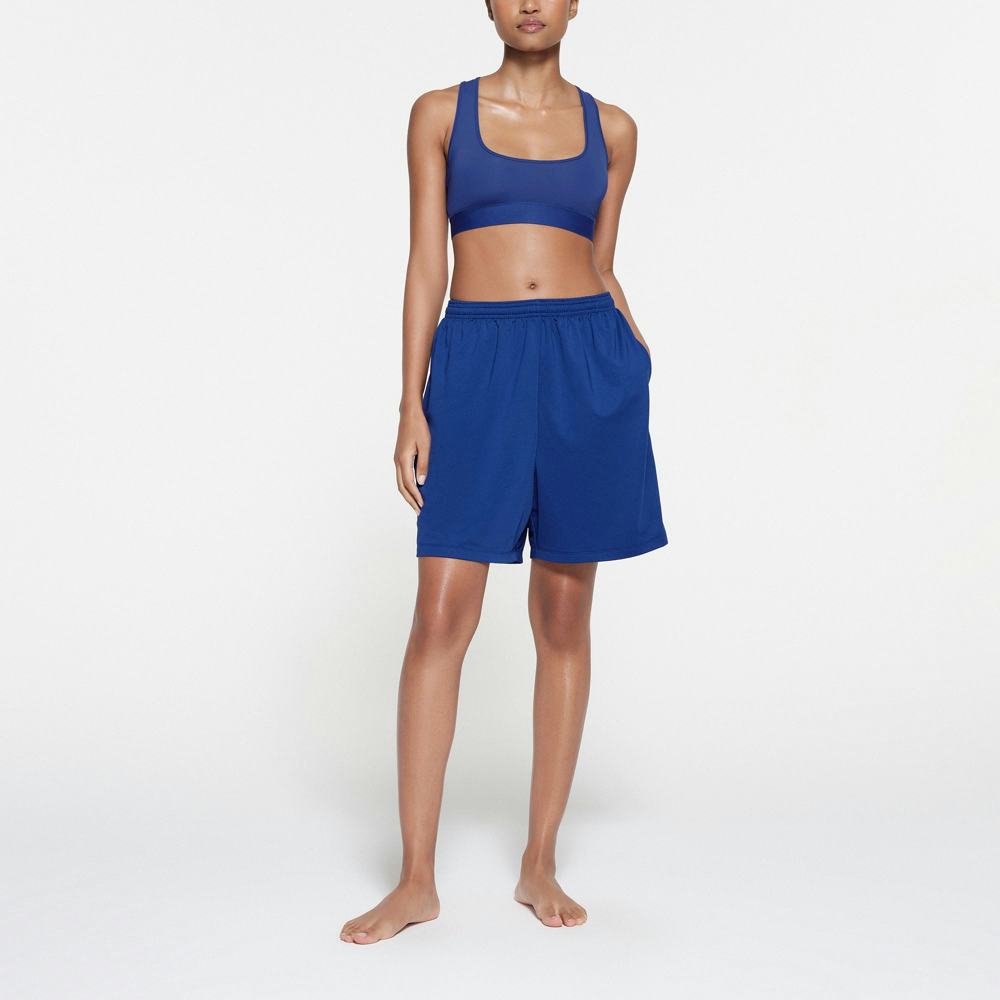 SKIMS TRACK MESH SHORT | COBALT ON A MODEL FRONT VIEW