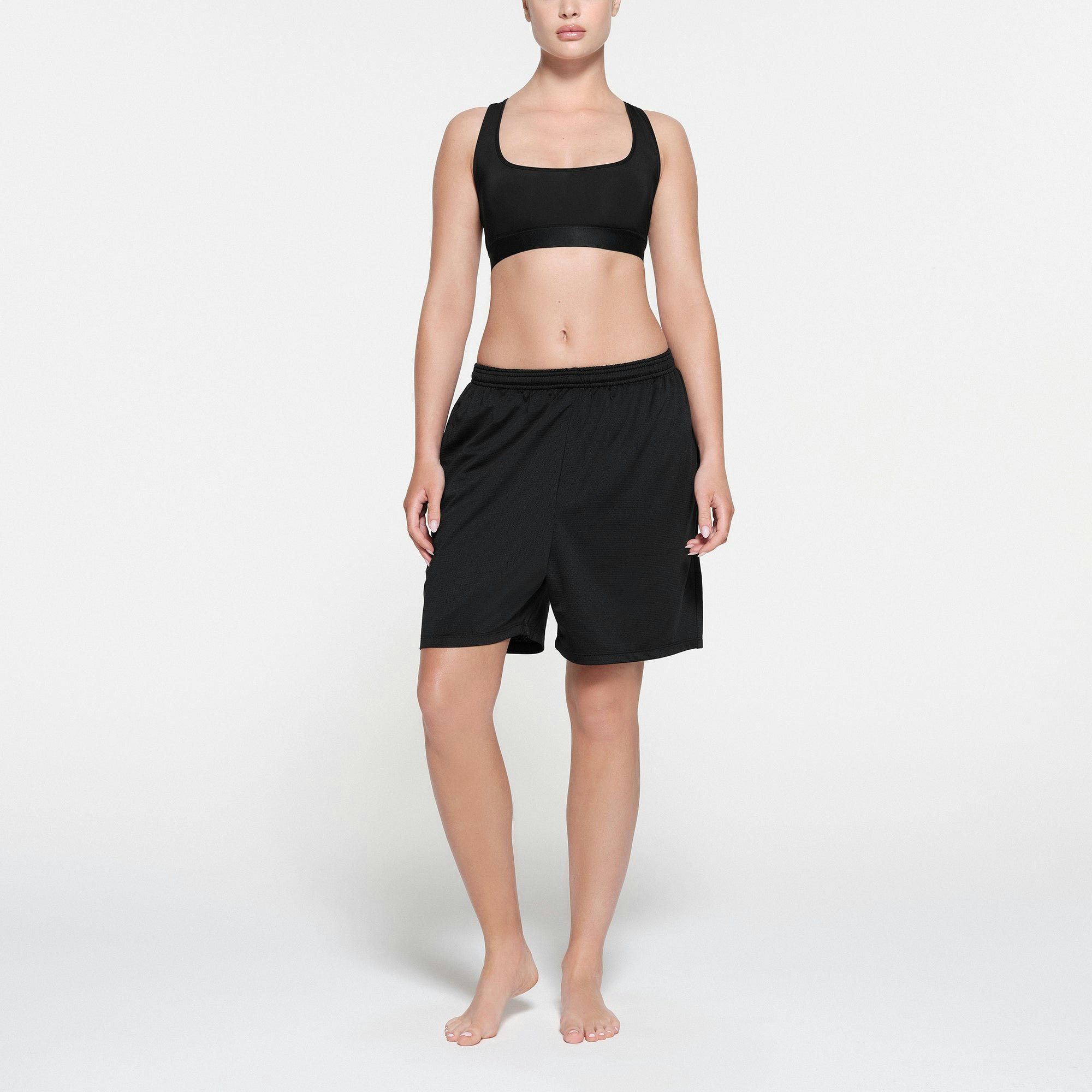 SKIMS TRACK MESH SHORT | ONYX ON A MODEL FRONT VIEW