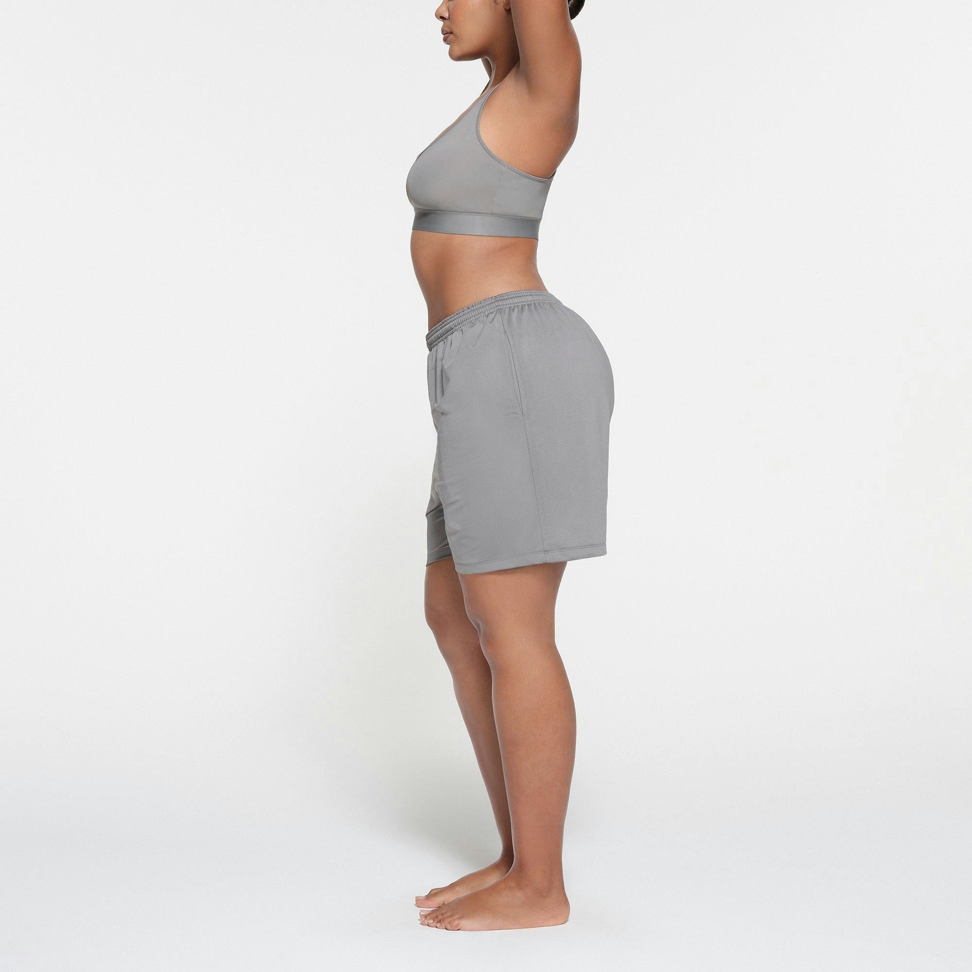 SKIMS TRACK MESH SHORT | PACIFIC ON A MODEL SIDE VIEW