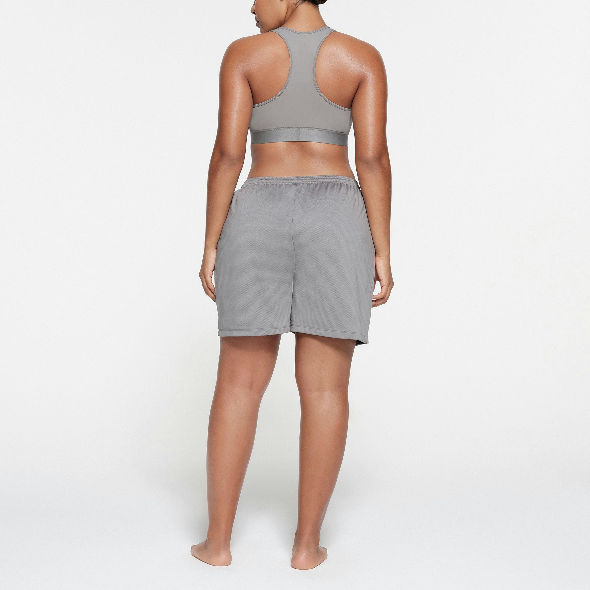 SKIMS TRACK MESH SHORT | PACIFIC ON A MODEL BACK VIEW
