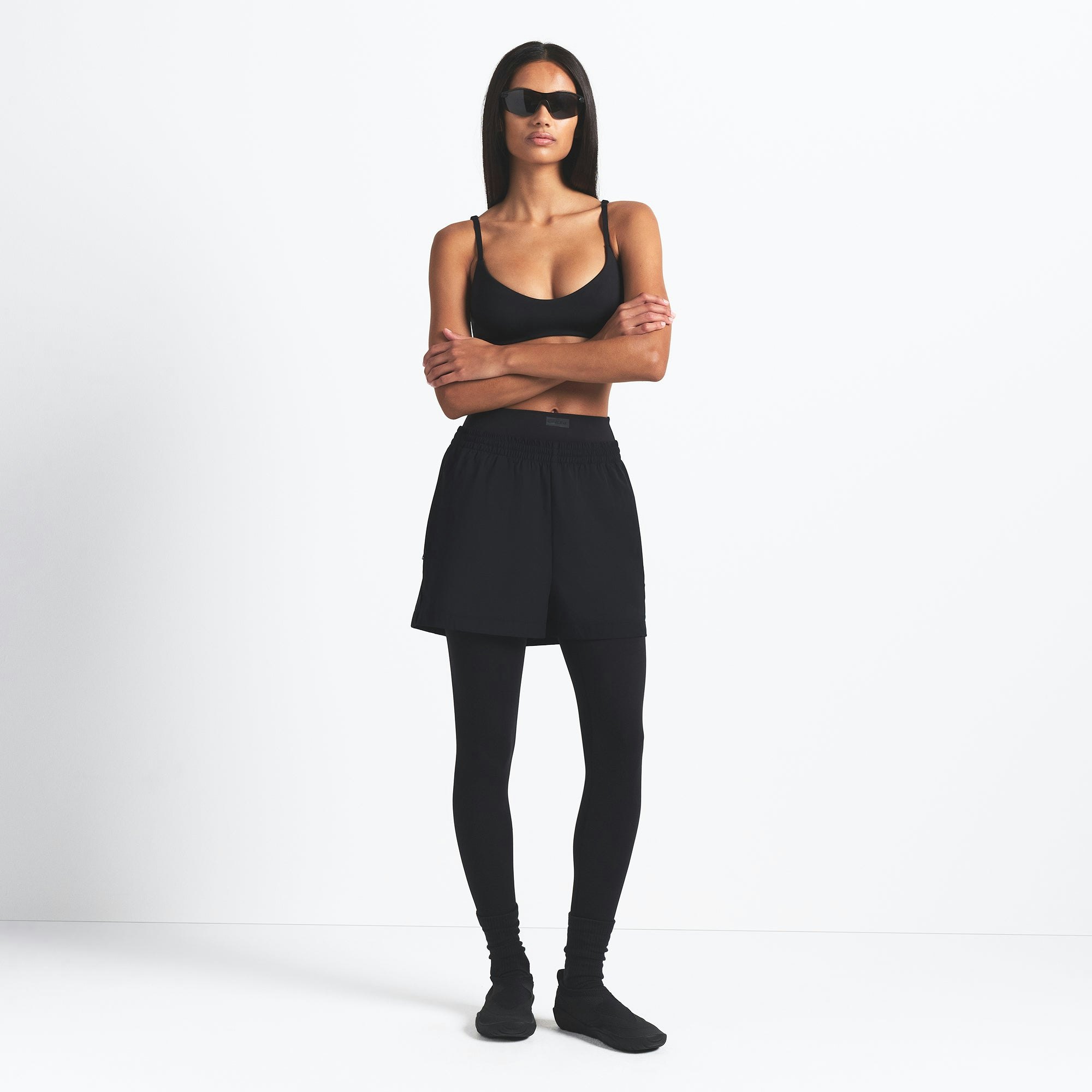 NikeSKIMS WOVEN NYLON 5" TRACK SHORT | OBSIDIAN ON A MODEL FRONT VIEW @ | FOCUS: 0.0, 1.0, 0.9