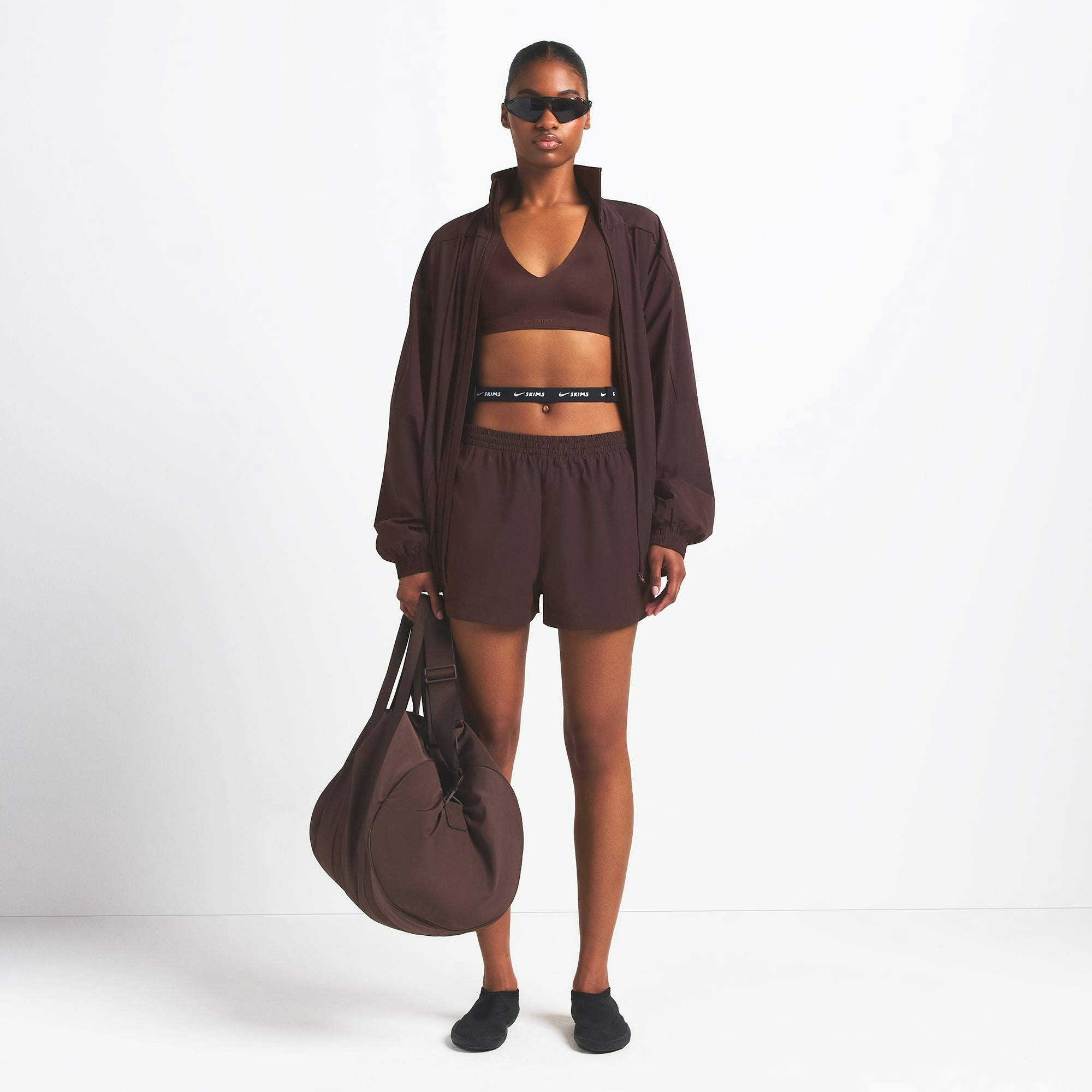 NikeSKIMS WOVEN NYLON 5" TRACK SHORT | PHOENIX ON A MODEL FRONT VIEW @ | FOCUS: 0.0, 1.0, 0.9