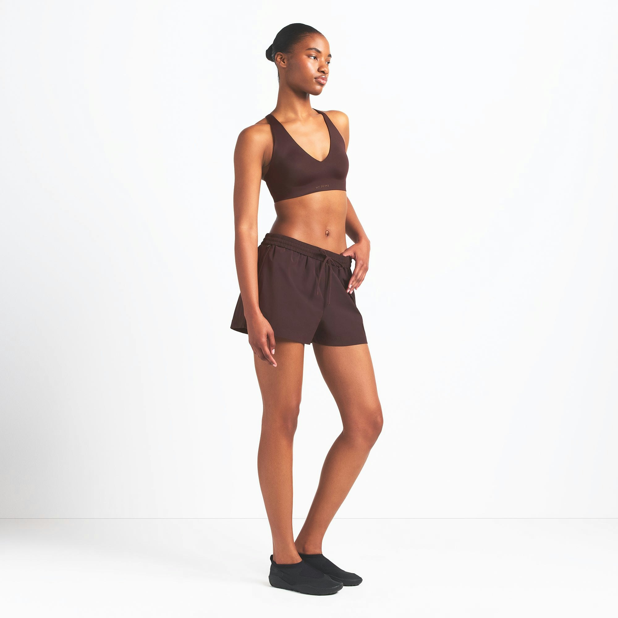 NikeSKIMS WOVEN NYLON 5" TRACK SHORT | PHOENIX ON A MODEL SIDE VIEW @ | FOCUS: 0.0, 1.0, 0.9