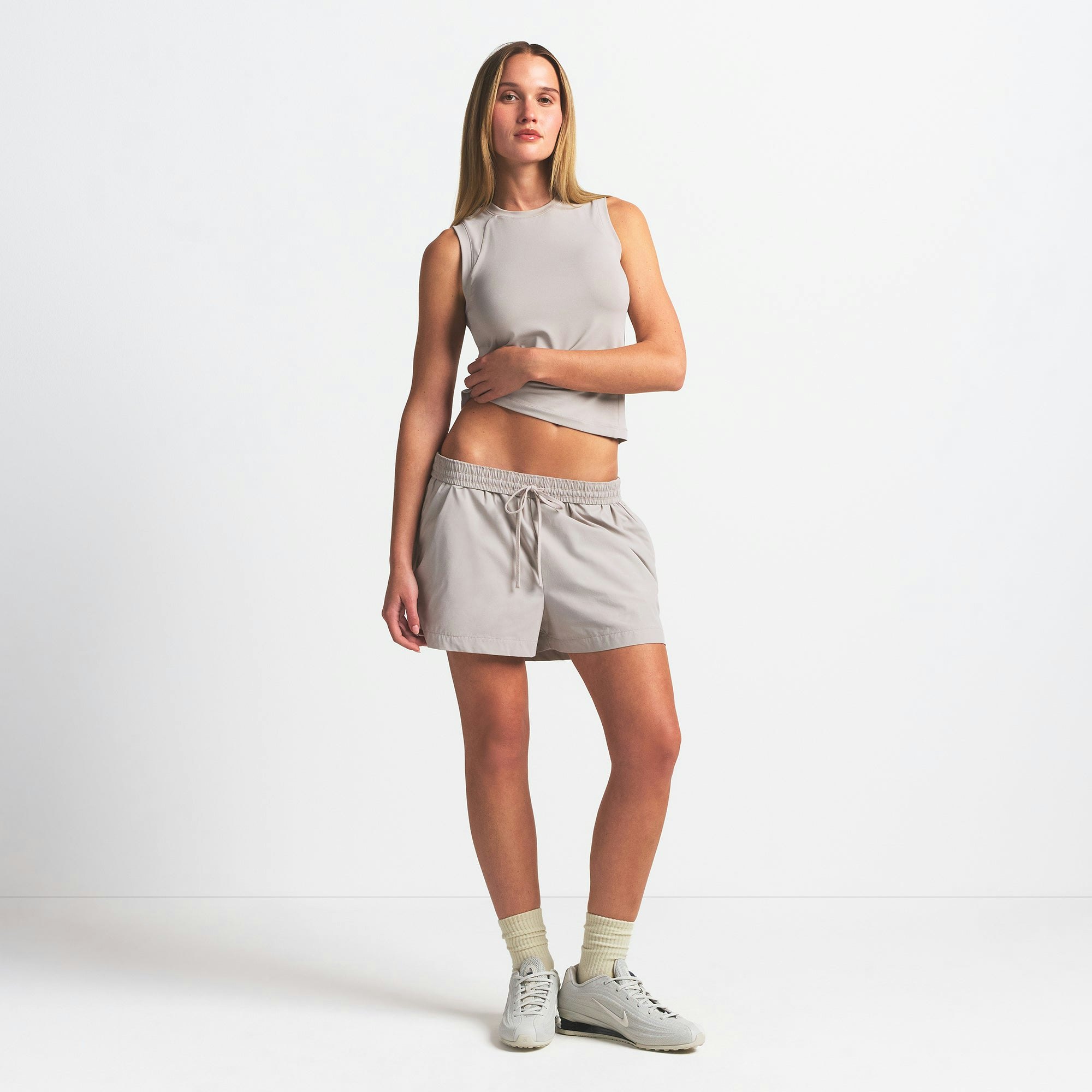 NikeSKIMS WOVEN NYLON 5" TRACK SHORT | STONE ON A MODEL FRONT VIEW @ | FOCUS: 0.0, 1.0, 0.9