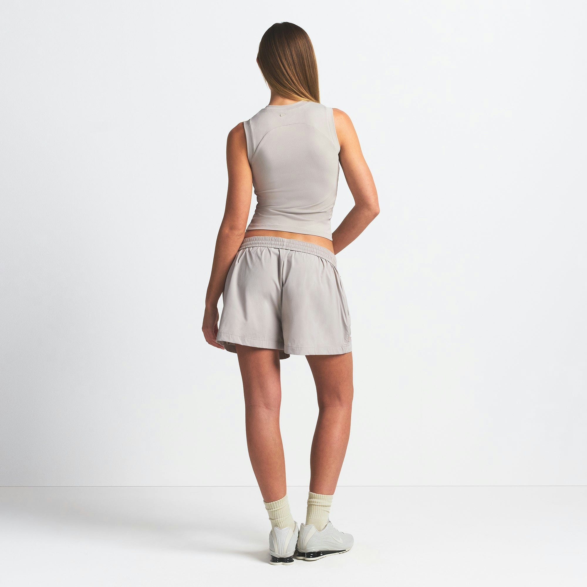 NikeSKIMS WOVEN NYLON 5" TRACK SHORT | STONE ON A MODEL BACK VIEW @ | FOCUS: 0.0, 1.0, 0.9