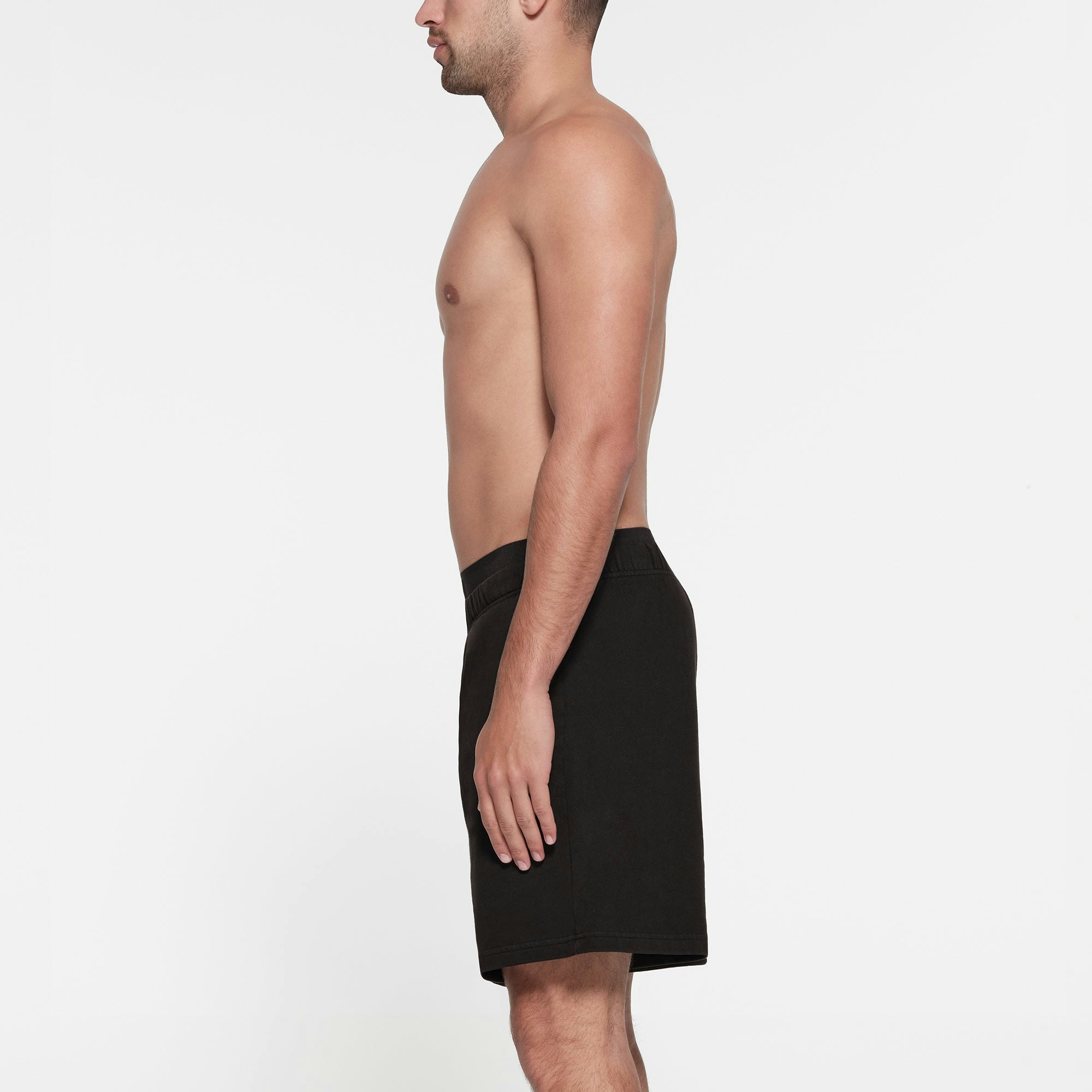 TERRY FLEECE MENS RELAXED SHORT | WASHED OBSIDIAN ON A MODEL SIDE VIEW
