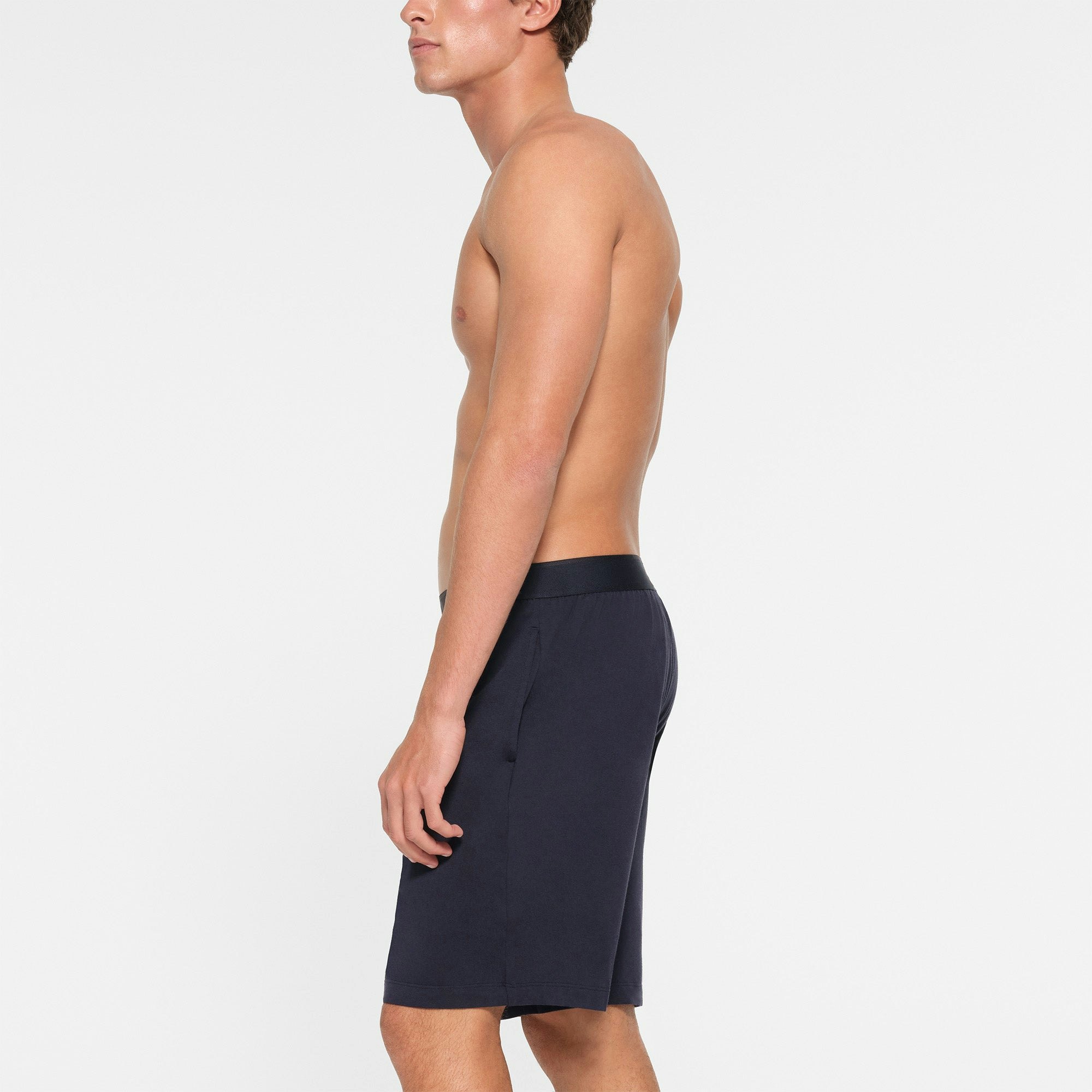JERSEY SLEEP MENS SHORT | MIDNIGHT BLUE ON A MODEL SIDE VIEW