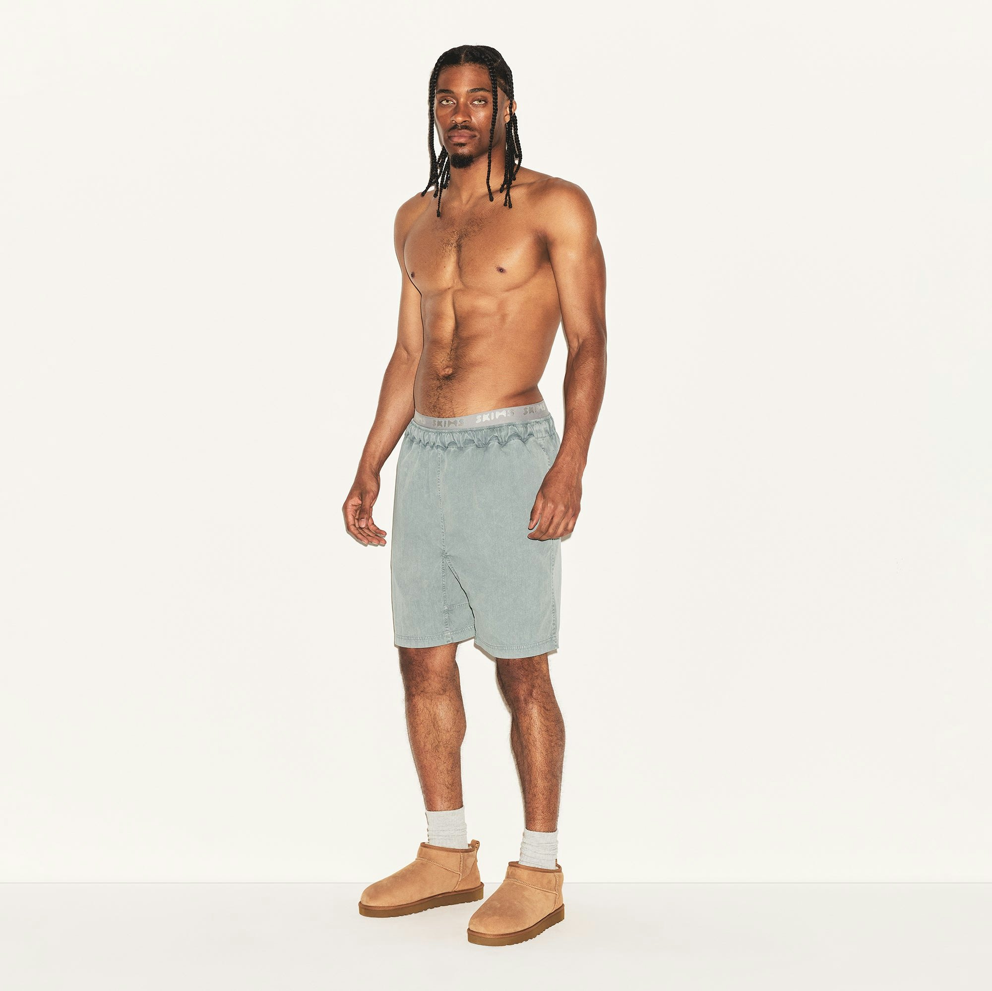WOVEN MENS SHORT | PACIFIC ON A MODEL SIDE VIEW | FOCUS: 0.0, 1.0, 0.9