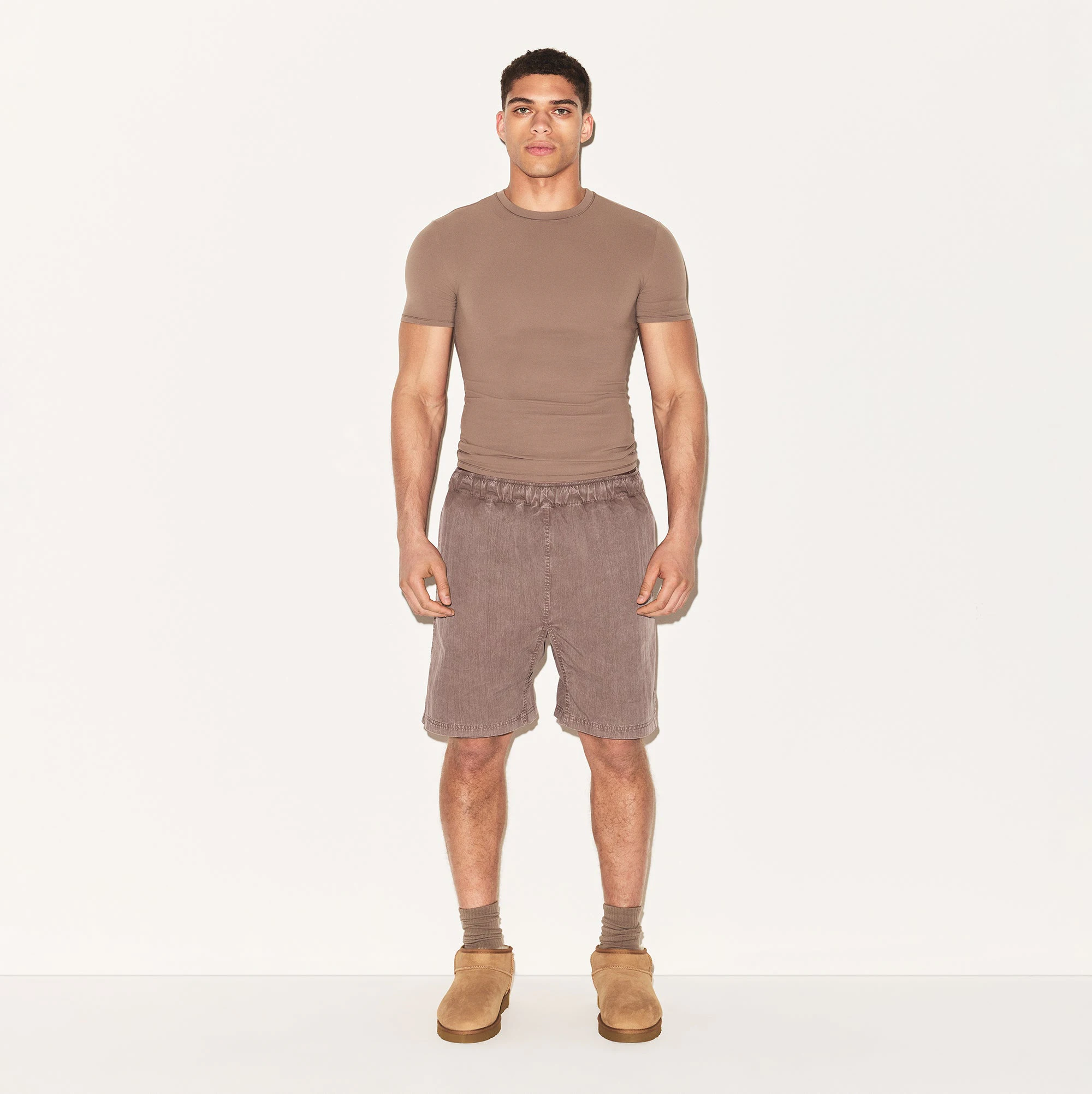WOVEN MENS SHORT | UMBER ON A MODEL FRONT VIEW | FOCUS: 0.0, 1.0, 0.9