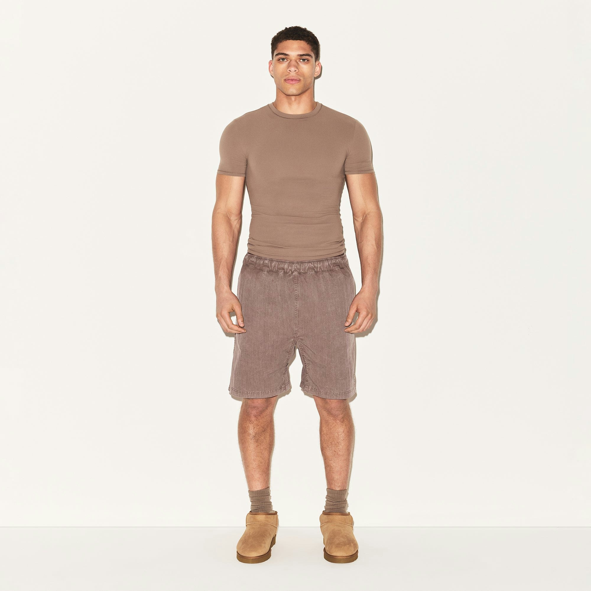 WOVEN MENS SHORT | UMBER ON A MODEL FRONT VIEW | FOCUS: 0.0, 1.0, 0.9