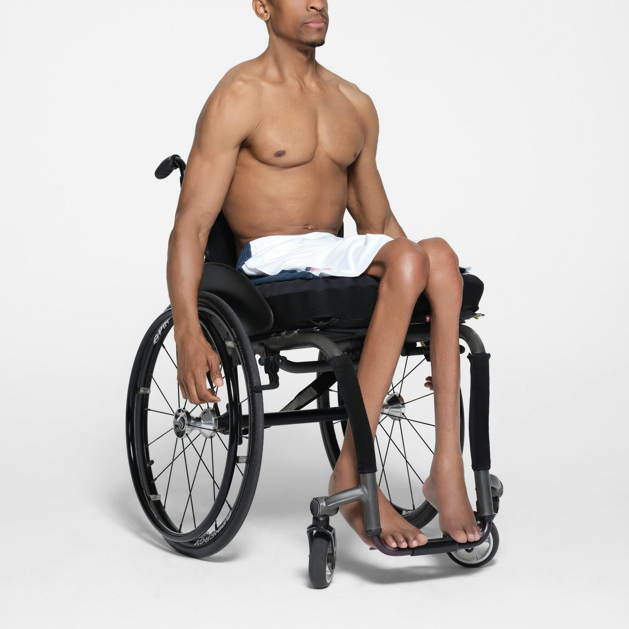 SKIMS FOR TEAM USA SKIMS COTTON MENS PARALYMPIC SHORT | WHITE ON A MODEL SIDE VIEW