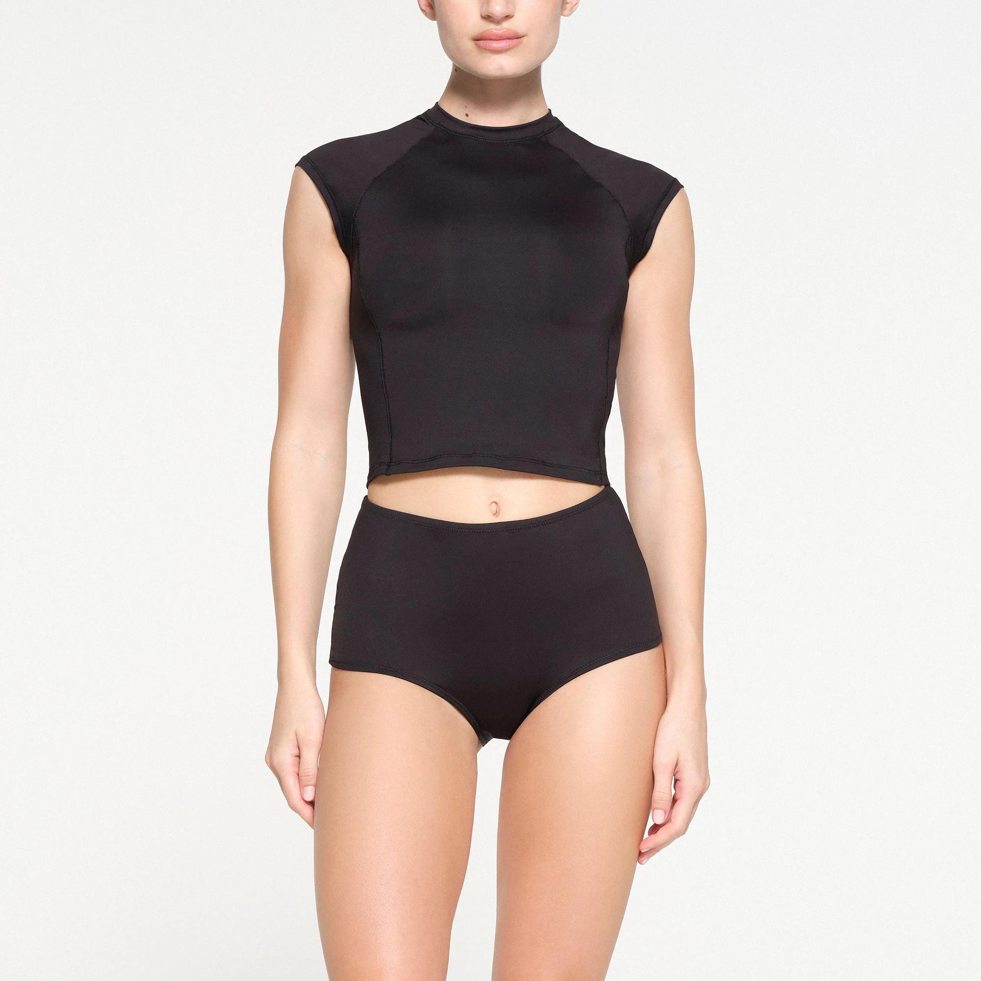 SIGNATURE SWIM BOY SHORT | ONYX ON A MODEL FRONT VIEW