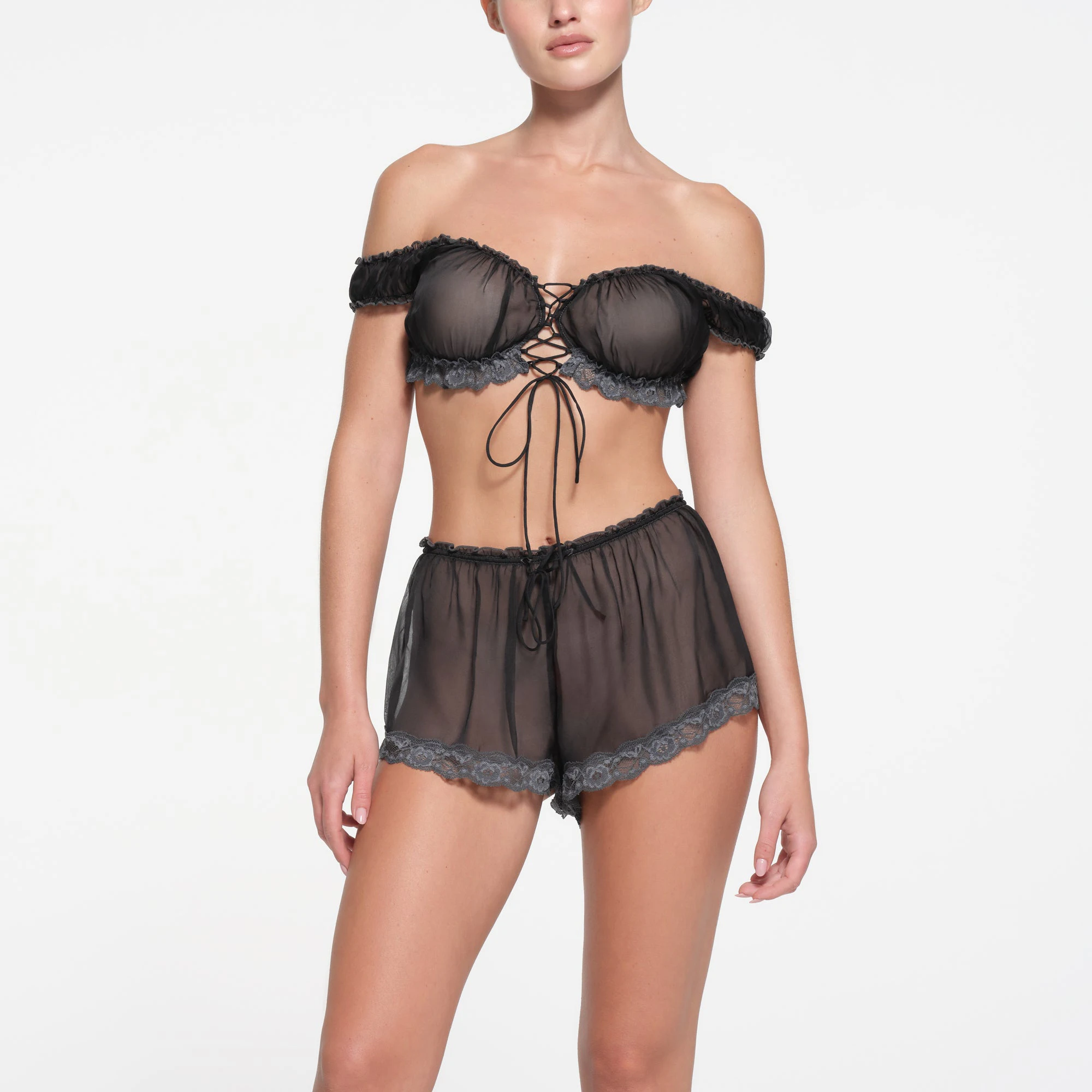 SKIMS ROMANCE SHORT | ONYX ON A MODEL FRONT VIEW