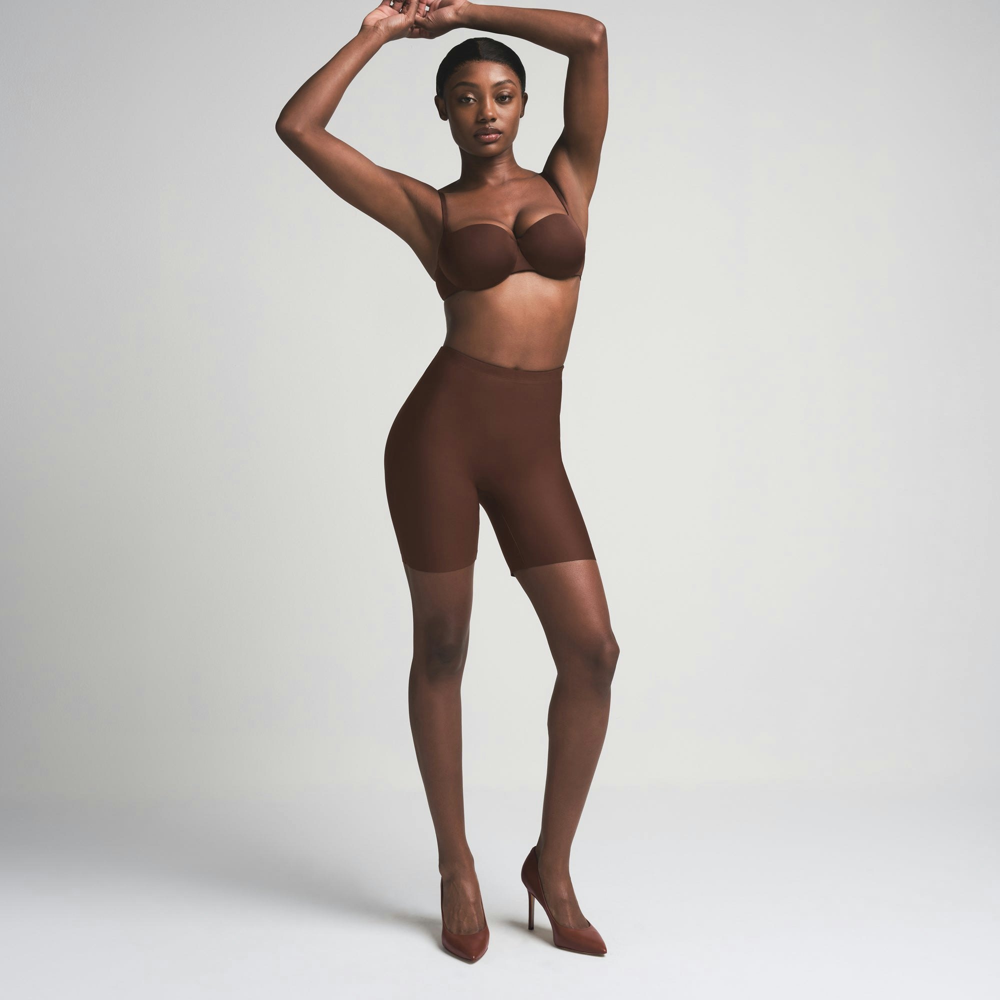 SKIMS BODY BUTT ENHANCING PADDED SHORT | COCOA ON A MODEL FRONT VIEW | FOCUS: 0.0, 1.0, 0.9