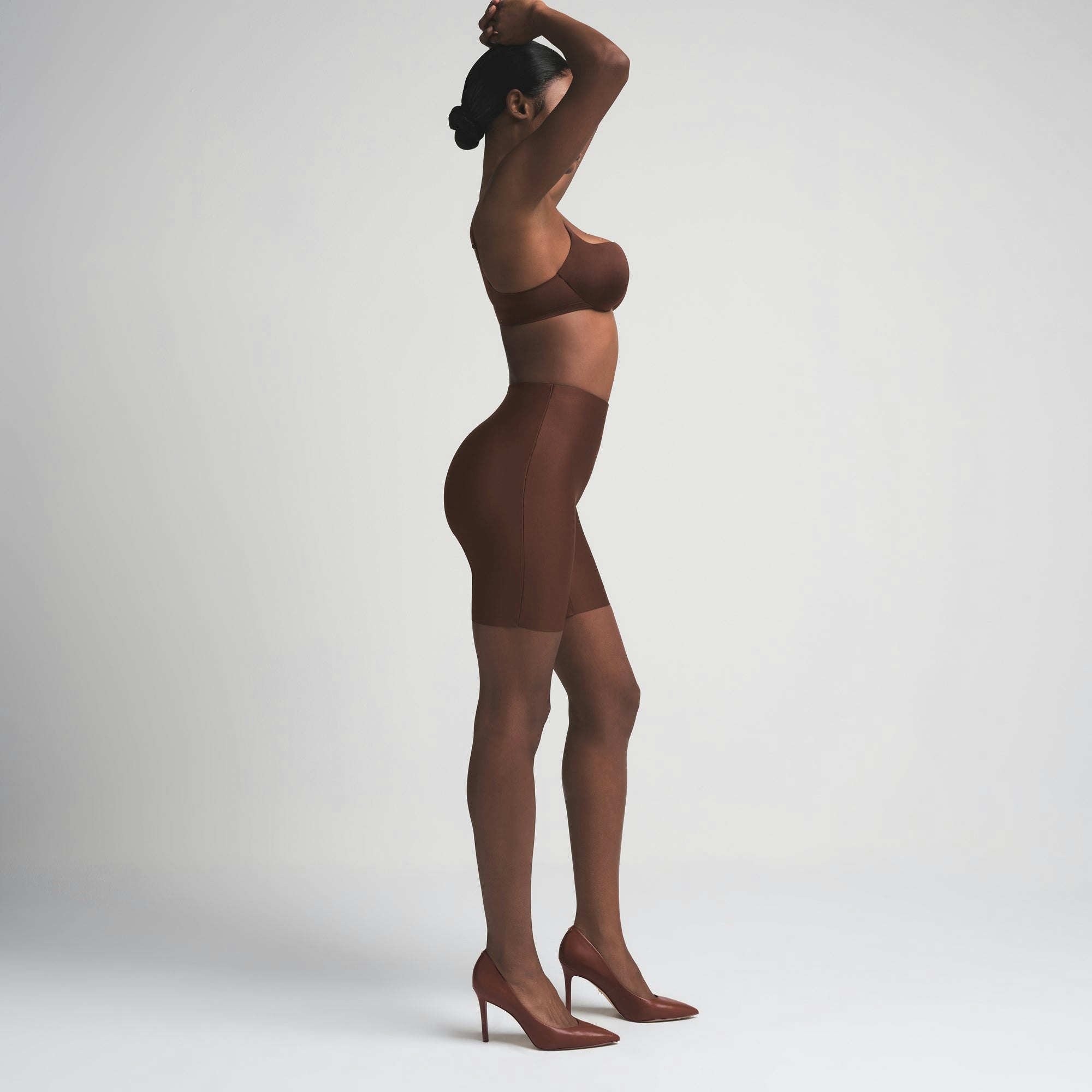 SKIMS BODY BUTT ENHANCING PADDED SHORT | COCOA ON A MODEL FRONT VIEW | FOCUS: 0.0, 1.0, 0.9