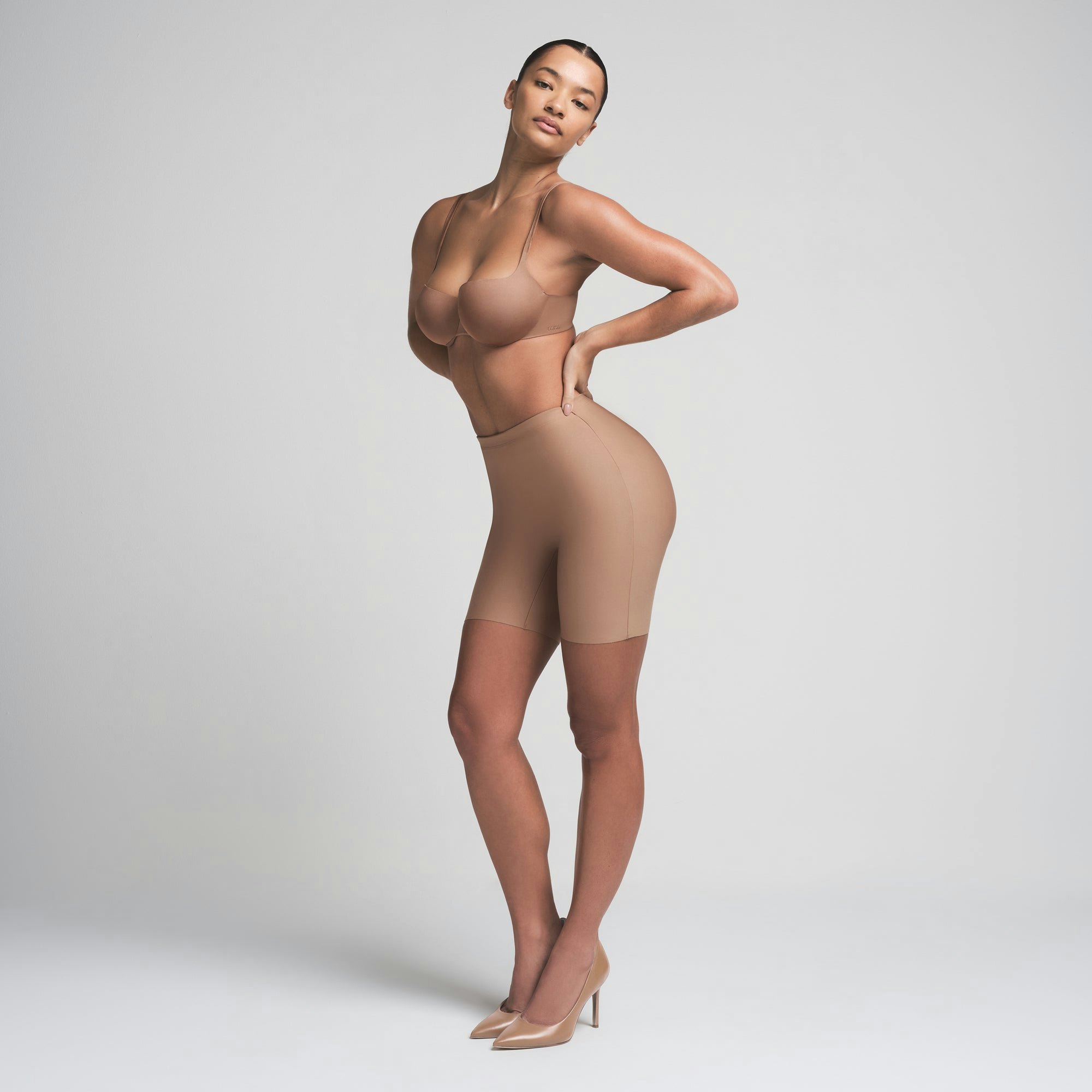 SKIMS BODY BUTT ENHANCING PADDED SHORT | SIENNA ON A MODEL FRONT VIEW