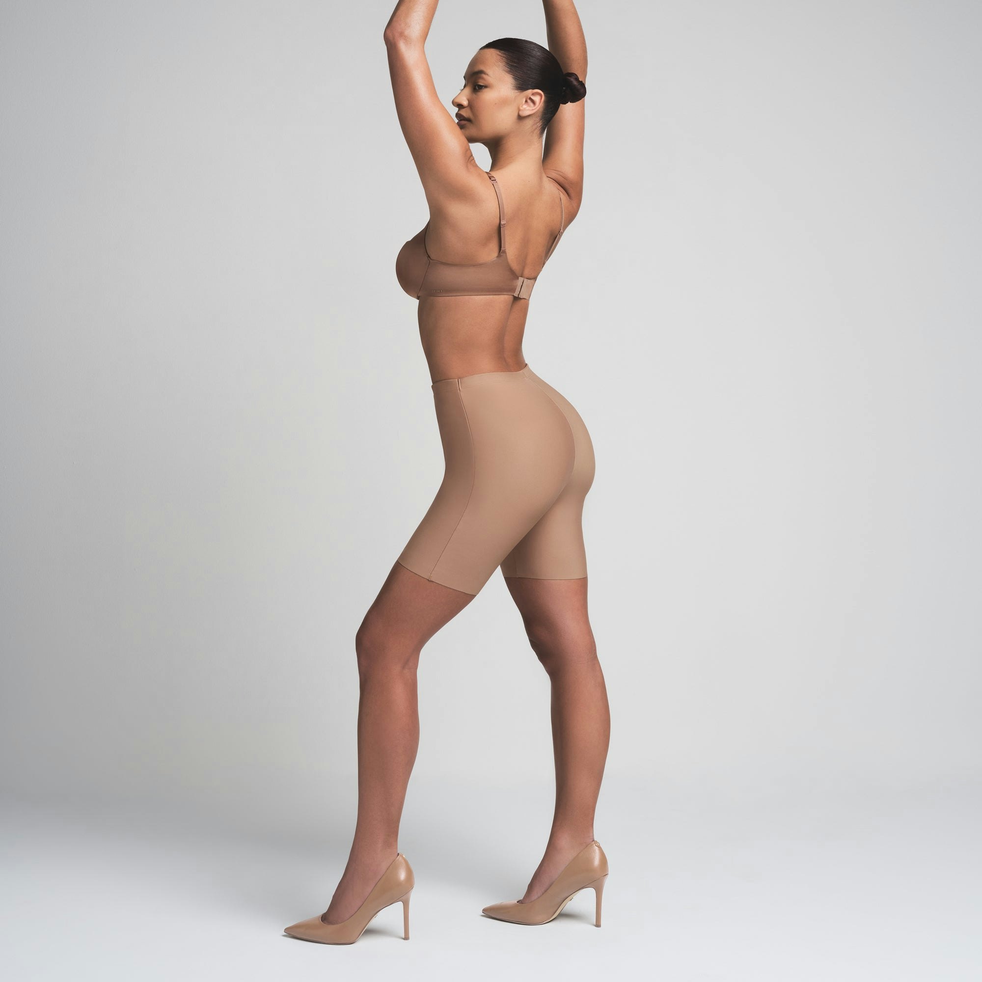 SKIMS BODY BUTT ENHANCING PADDED SHORT | SIENNA ON A MODEL FRONT VIEW