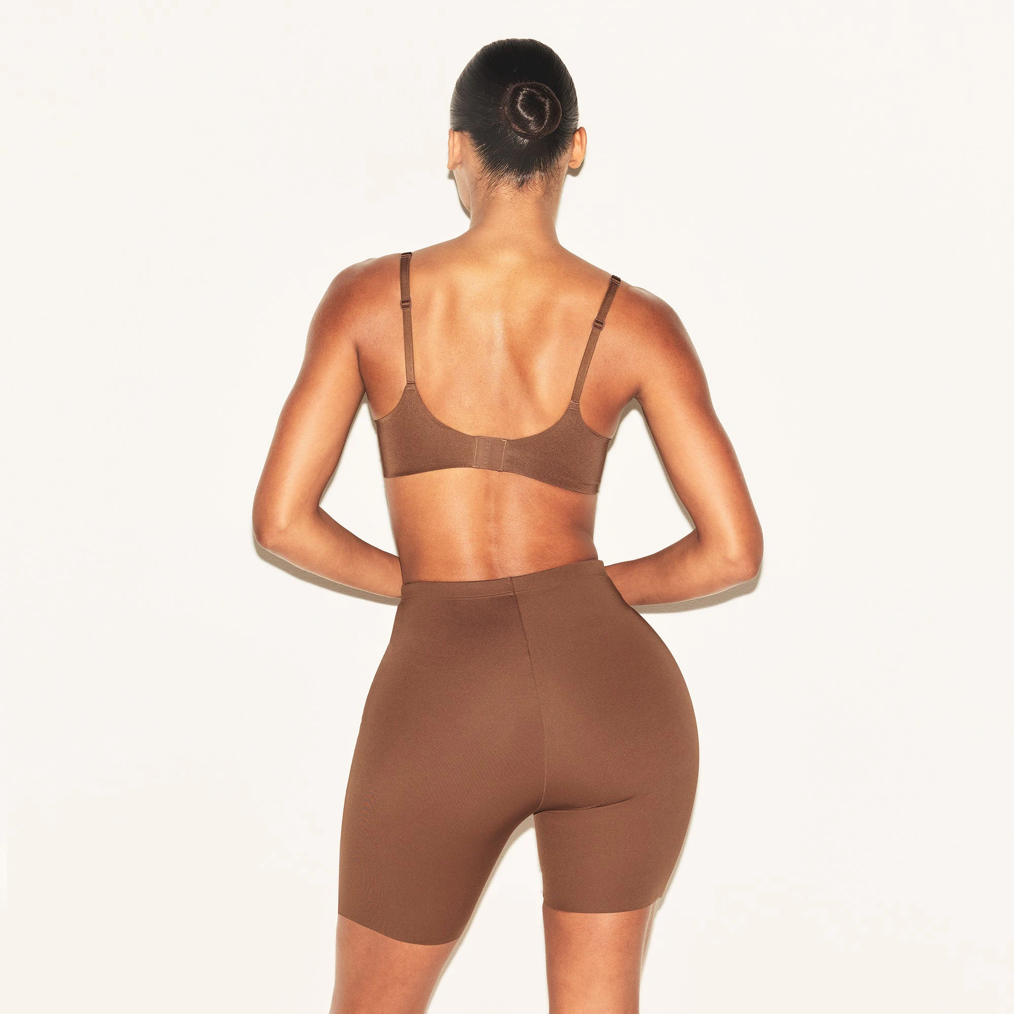 SKIMS BODY HIP ENHANCING PADDED SHORT | JASPER ON A MODEL BACK VIEW | FOCUS: 0.0, 1.0, 0.9