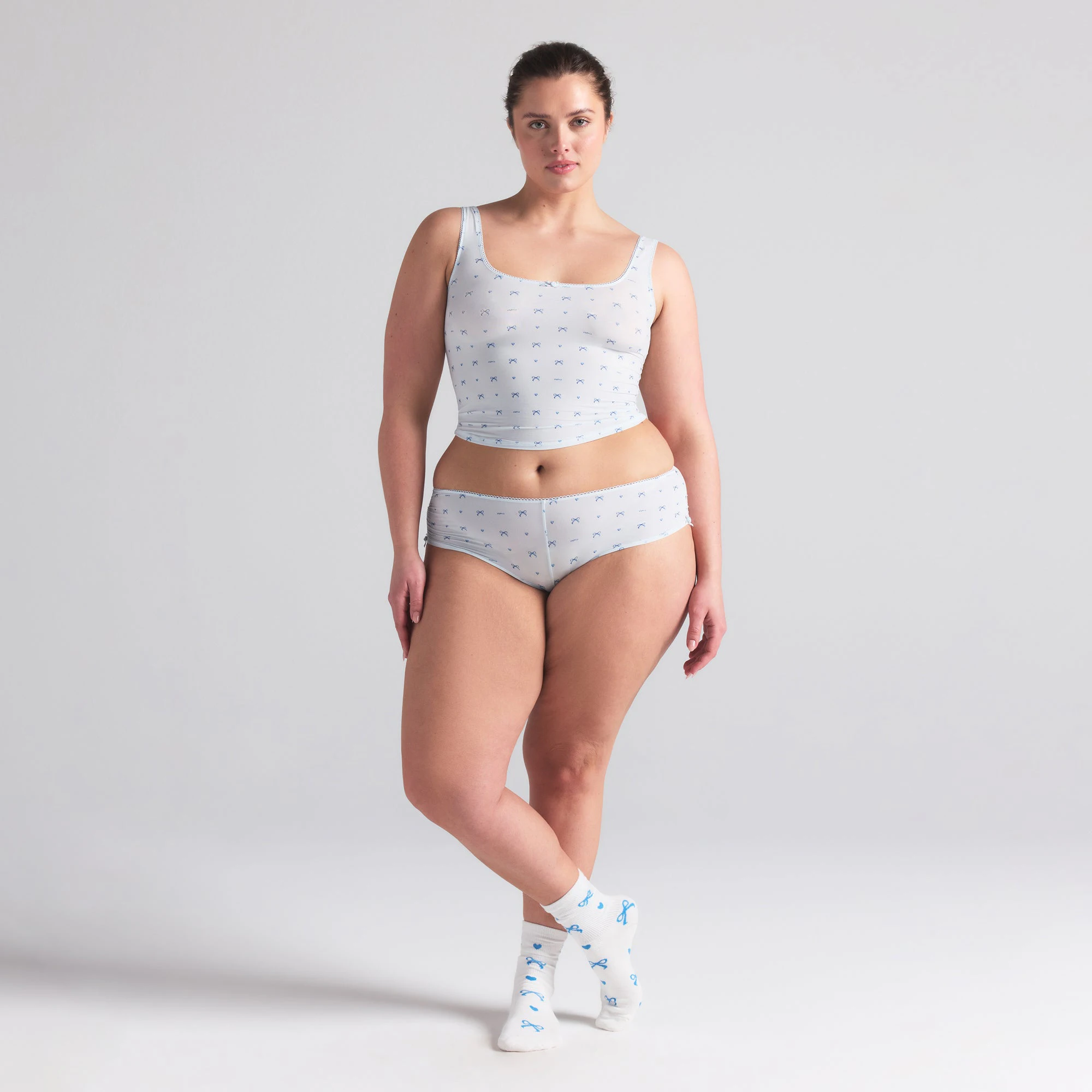 FITS EVERYBODY PICOT TANK AND HIPSTER SET | CLOUD BOW PRINT ON A MODEL FRONT  ON A MODEL FRONT VIEW | FOCUS: 0.0, 1.0, 0.9