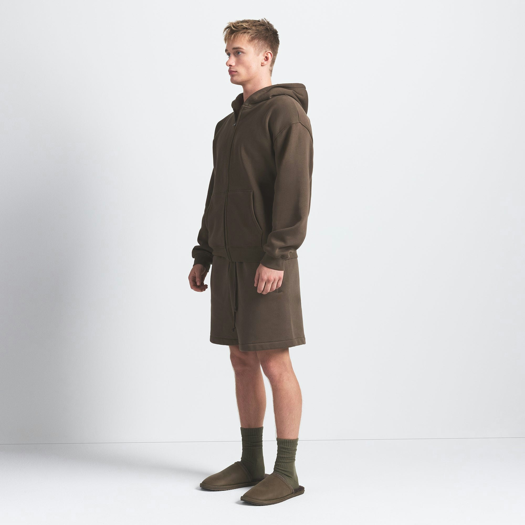 FLEECE LOUNGE MENS RELAXED SHORT | DRIFTWOOD ON A MODEL SIDE VIEW @ | FOCUS: 0.0, 1.0, 0.9