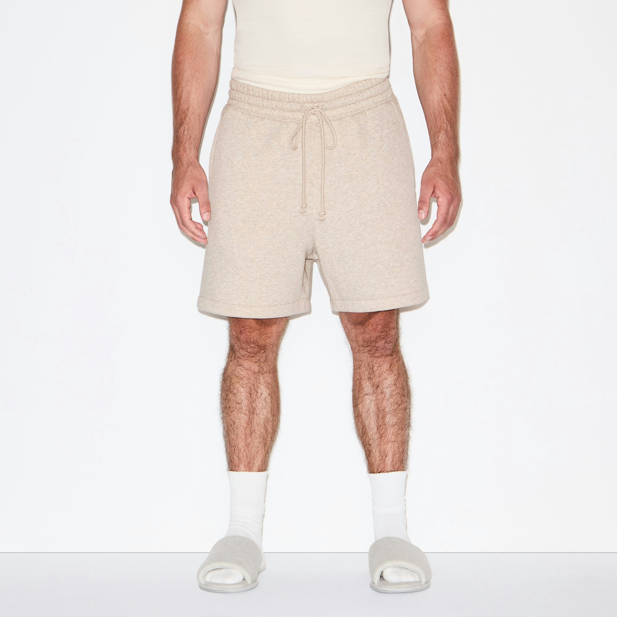 FLEECE LOUNGE MENS RELAXED SHORT | DESERT HEATHER ON A MODEL SIDE VIEW @ | FOCUS: 0.0, 1.0, 0.9
