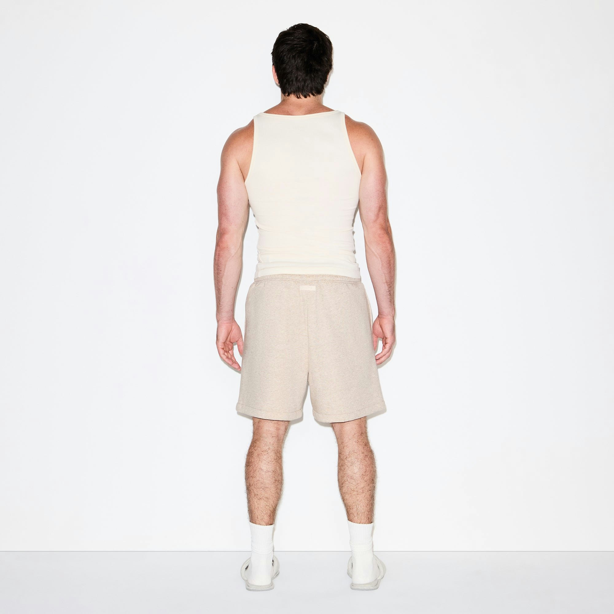 FLEECE LOUNGE MENS RELAXED SHORT | DESERT HEATHER ON A MODEL FRONT VIEW @ | FOCUS: 0.0, 1.0, 0.9