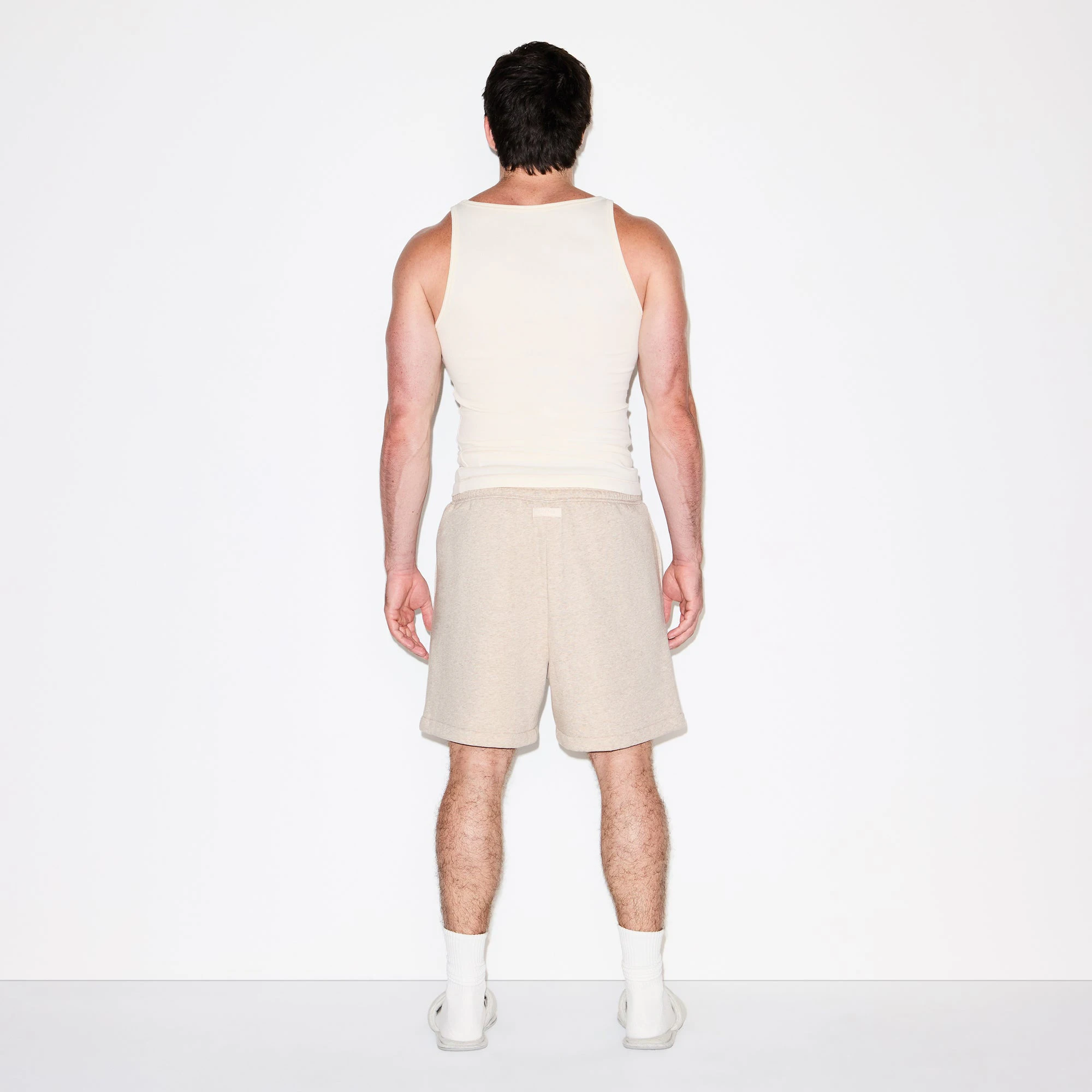 FLEECE LOUNGE MENS RELAXED SHORT | DESERT HEATHER ON A MODEL FRONT VIEW @ | FOCUS: 0.0, 1.0, 0.9