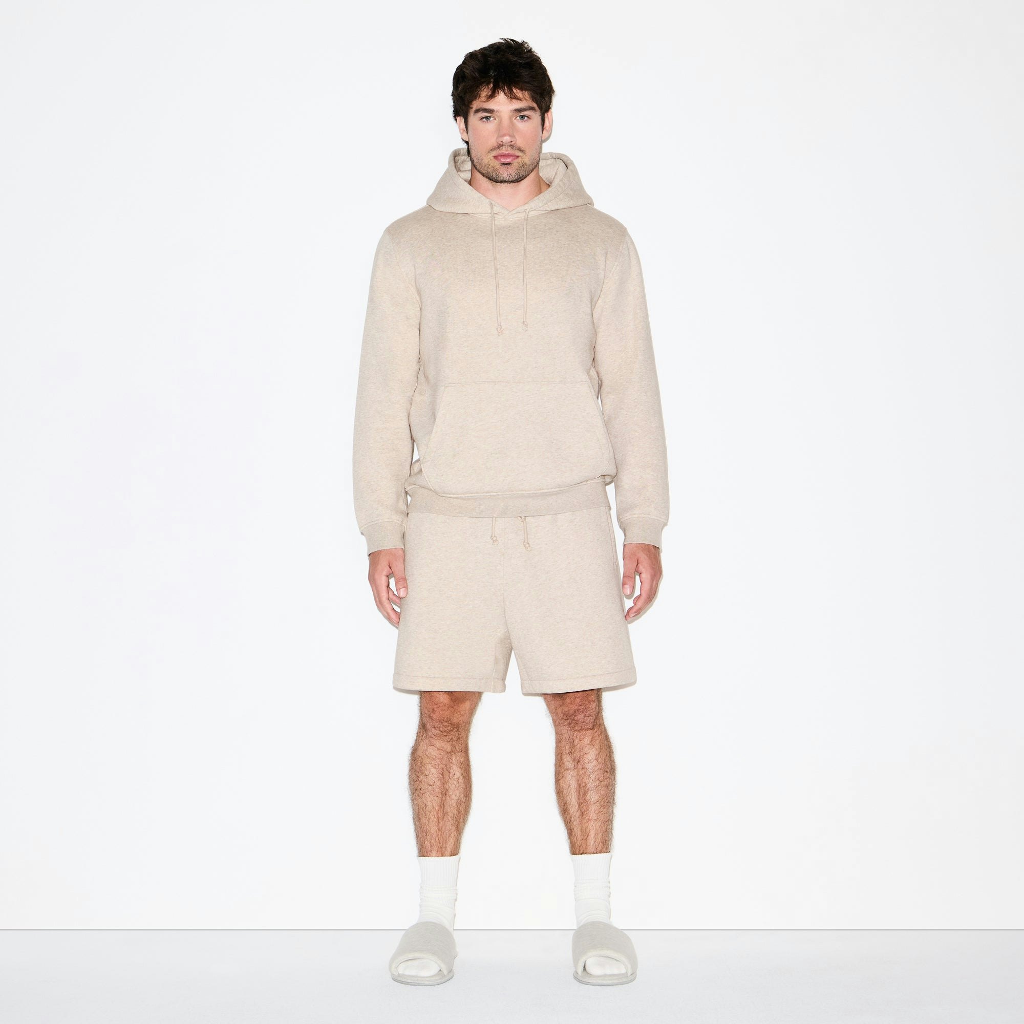 FLEECE LOUNGE MENS RELAXED SHORT | DESERT HEATHER ON A MODEL FRONT VIEW @ | FOCUS: 0.0, 1.0, 0.9