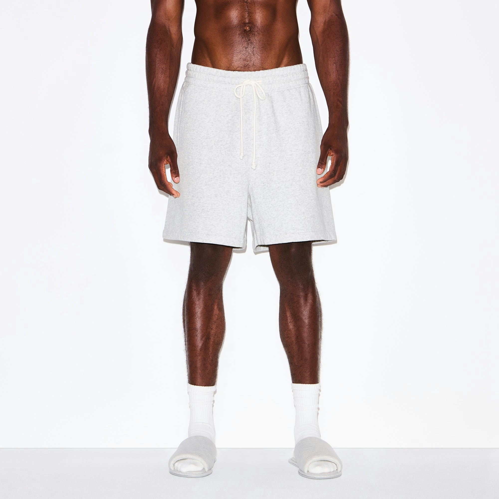FLEECE LOUNGE MENS RELAXED SHORT | LIGHT HEATHER GREY ON A MODEL SIDE VIEW @ | FOCUS: 0.0, 1.0, 0.9