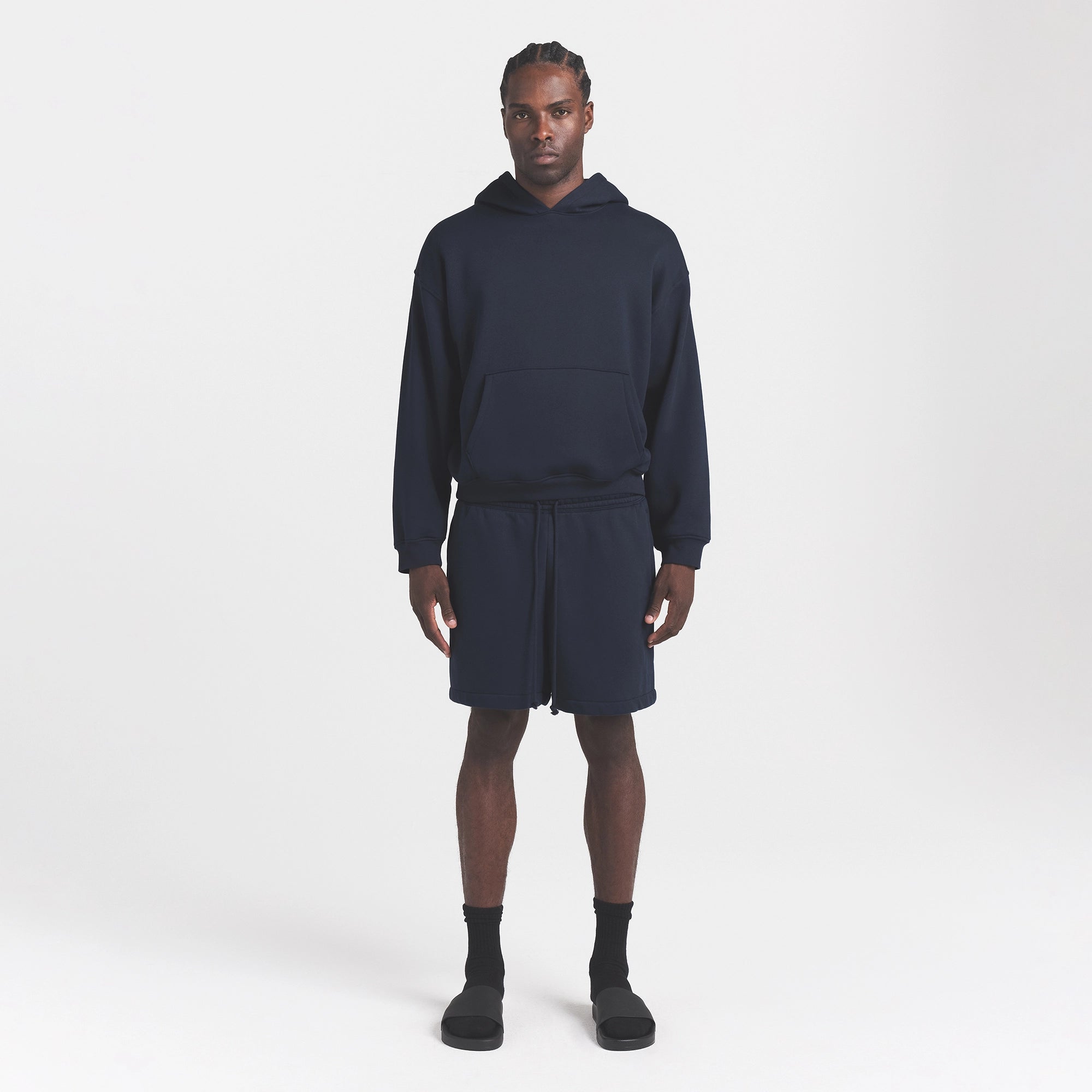 FLEECE LOUNGE MENS RELAXED SHORT | NAVY ON A MODEL FRONT VIEW @ | FOCUS: 0.0, 1.0, 0.9