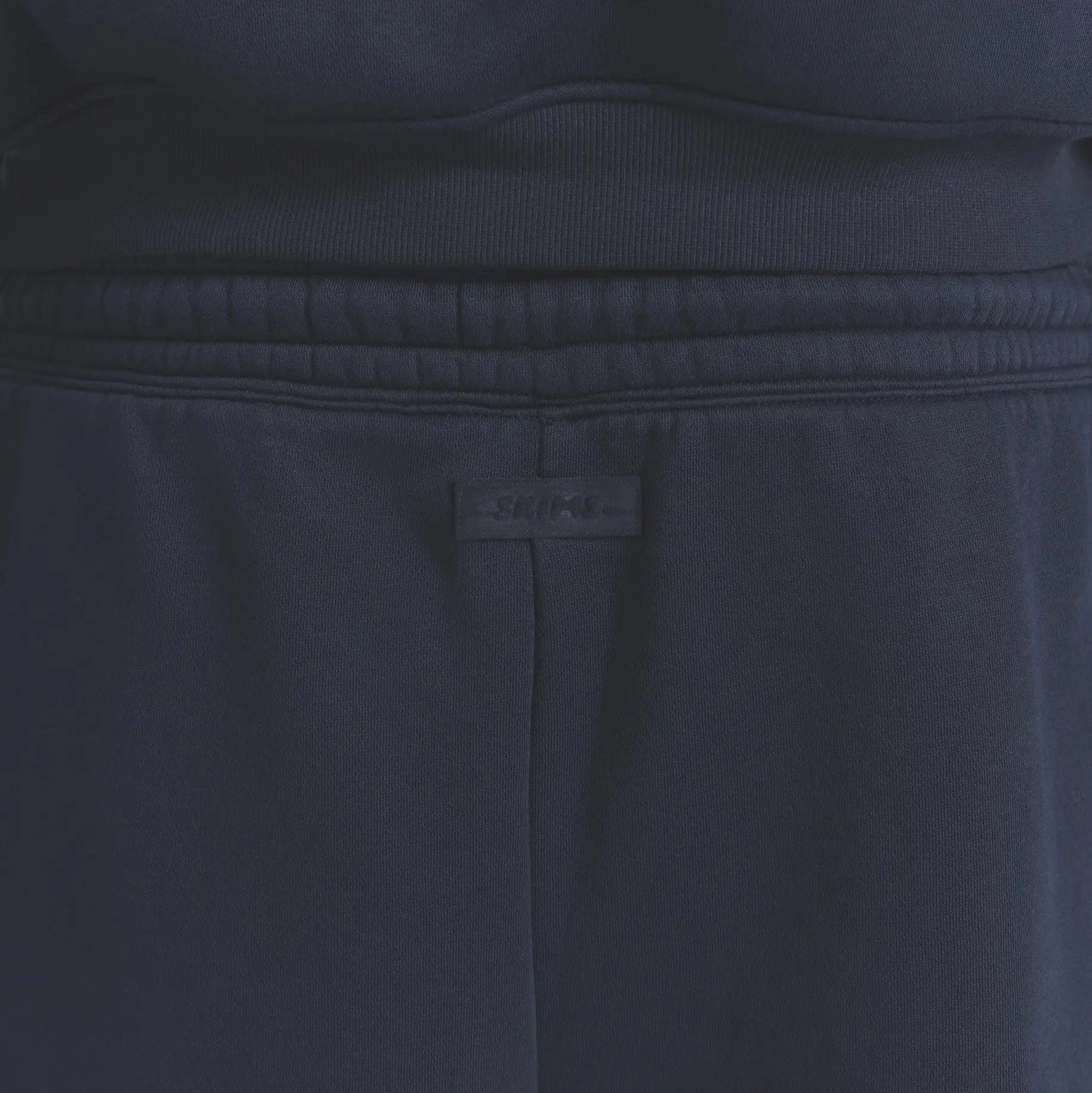 FLEECE LOUNGE MENS RELAXED SHORT | NAVY ON A MODEL BACK VIEW @ | FOCUS: 0.0, 1.0, 0.9