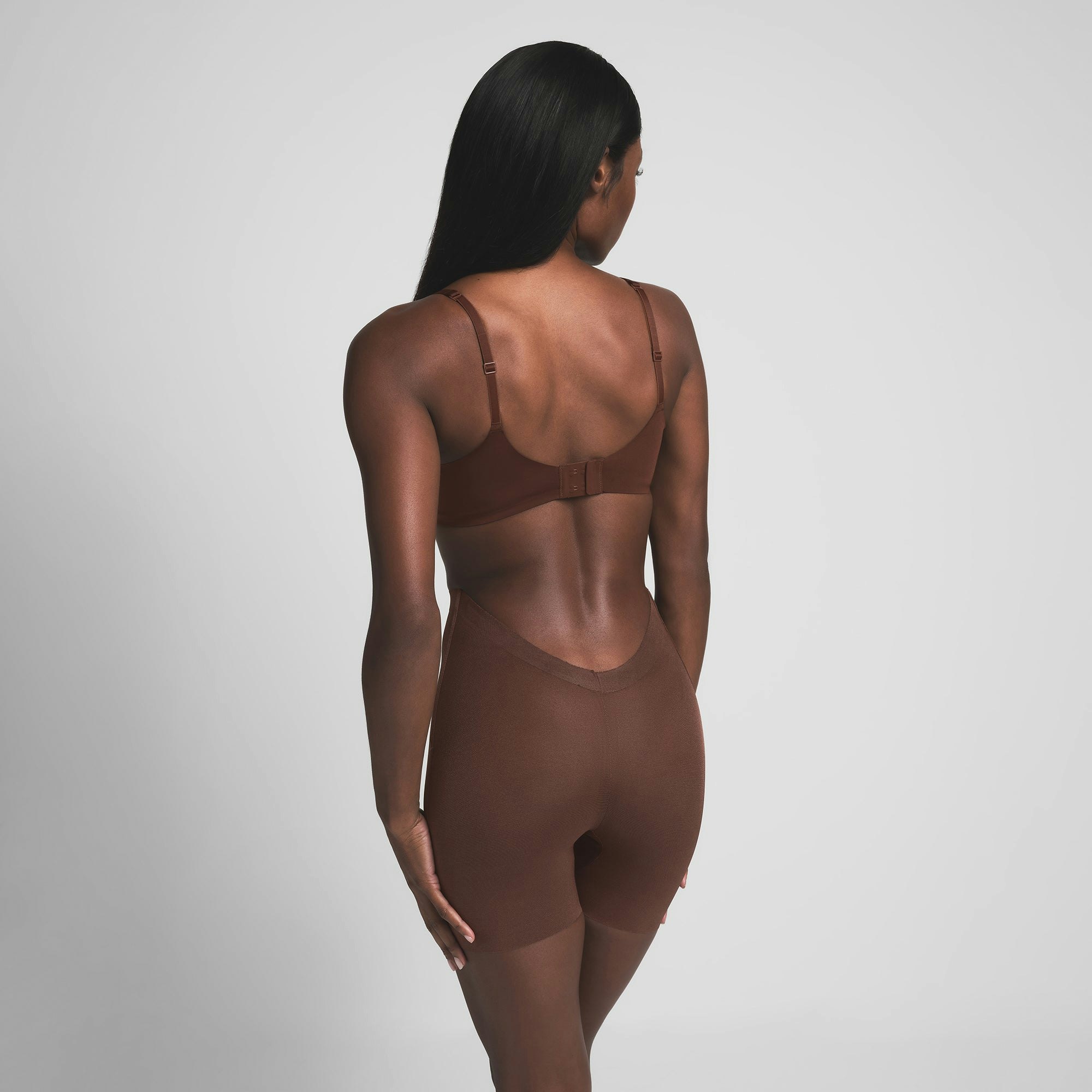 SHEER SCULPT LOW BACK SHORT | COCOA ON A MODEL BACK VIEW