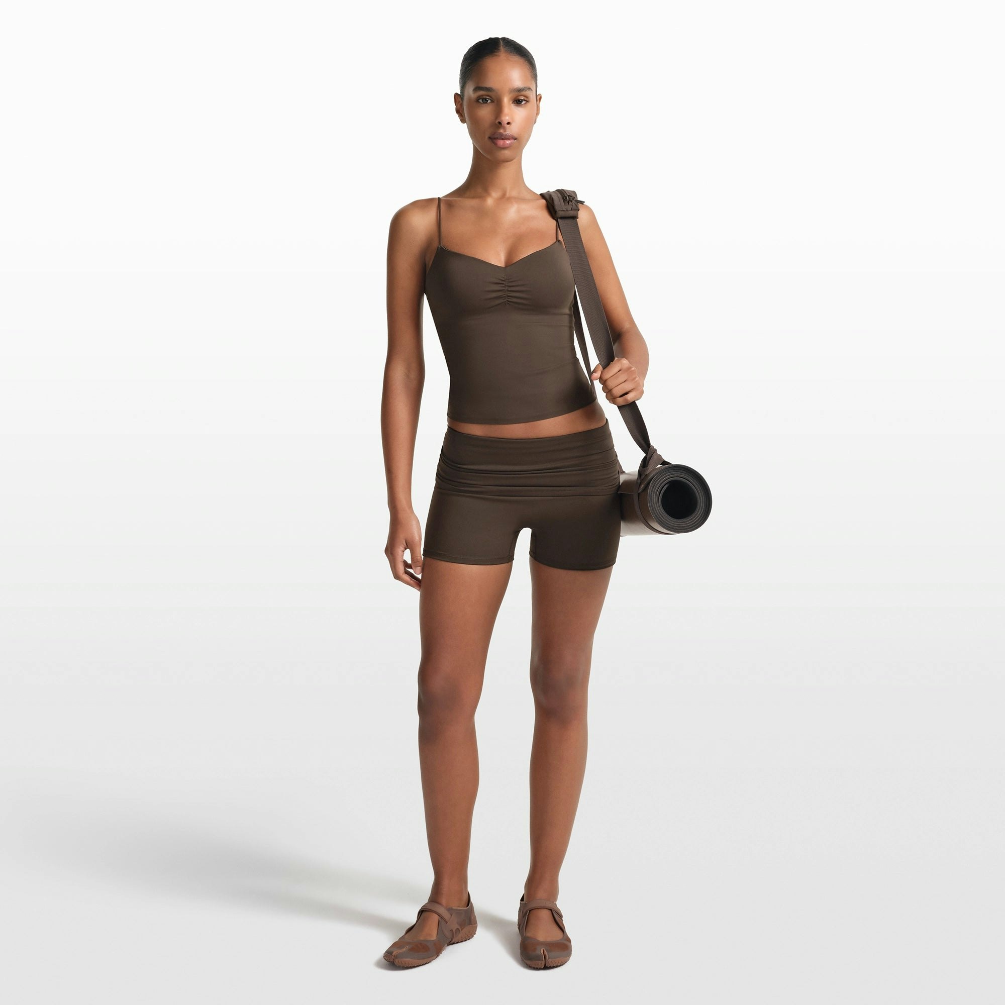 NikeSKIMS MATTE 3" FOLDOVER SHORT | DARK SEPIA ON A MODEL FRONT VIEW @ | FOCUS: 0.0, 1.0, 0.9