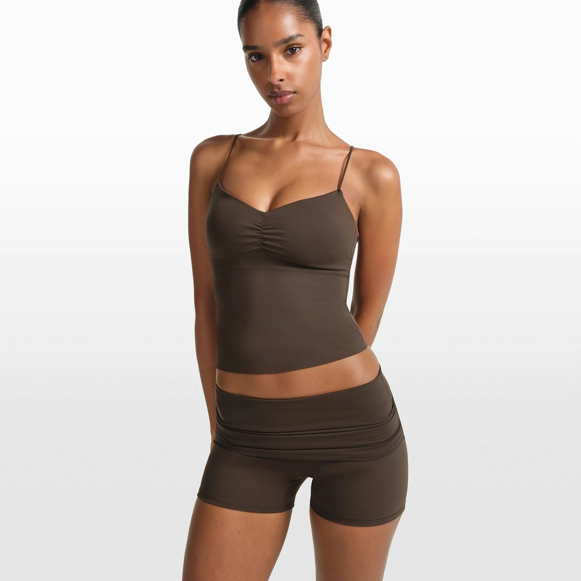 NikeSKIMS MATTE 3" FOLDOVER SHORT | DARK SEPIA ON A MODEL FRONT VIEW @ | FOCUS: 0.0, 1.0, 0.9
