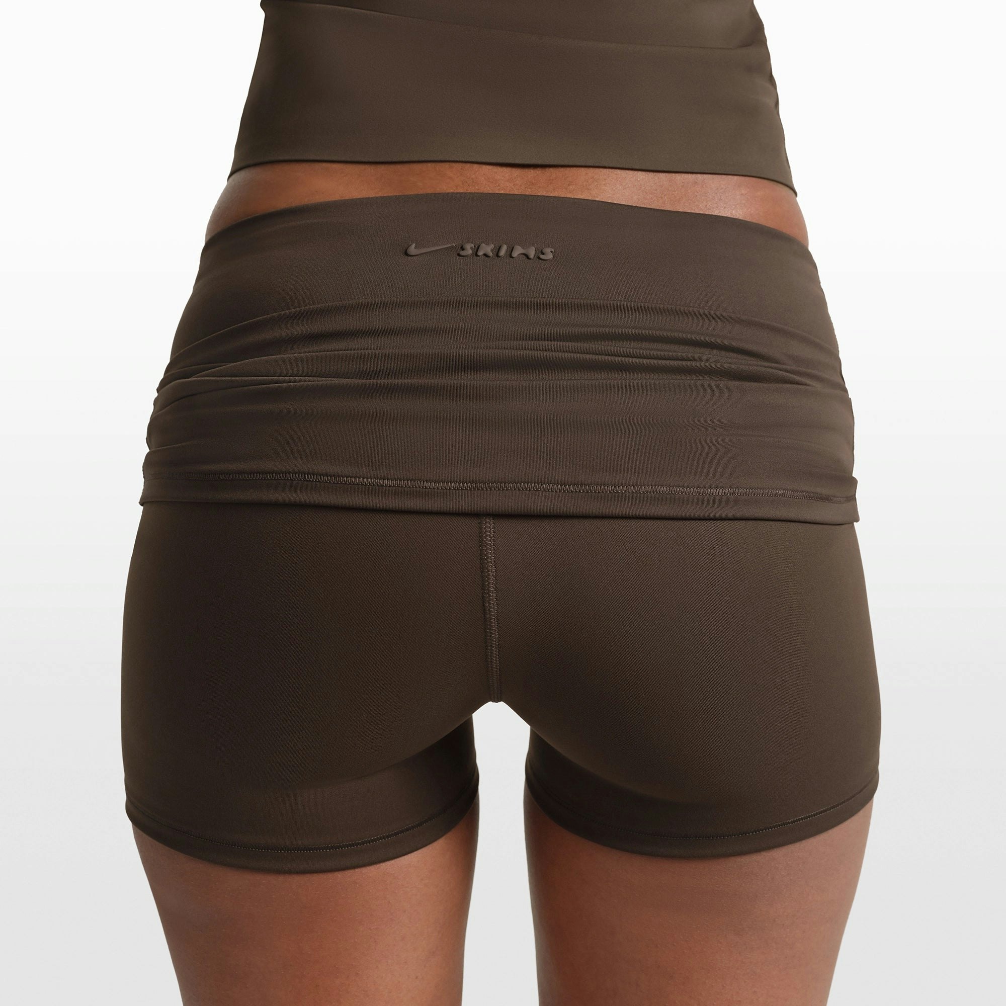 NikeSKIMS MATTE 3" FOLDOVER SHORT | DARK SEPIA ON A MODEL FRONT VIEW @ | FOCUS: 0.0, 1.0, 0.9